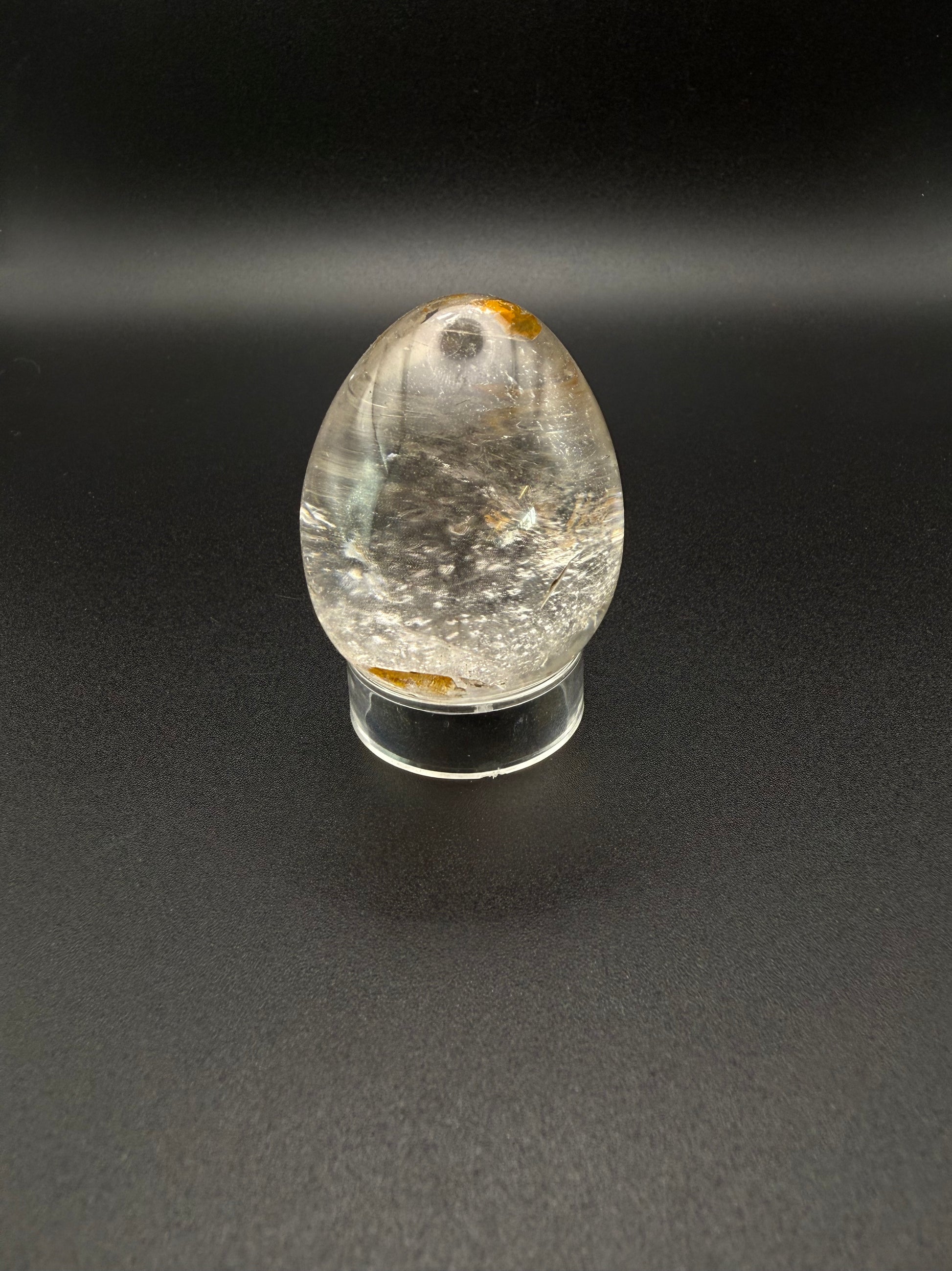 Clear quartz polished crystal thats egg shaped.