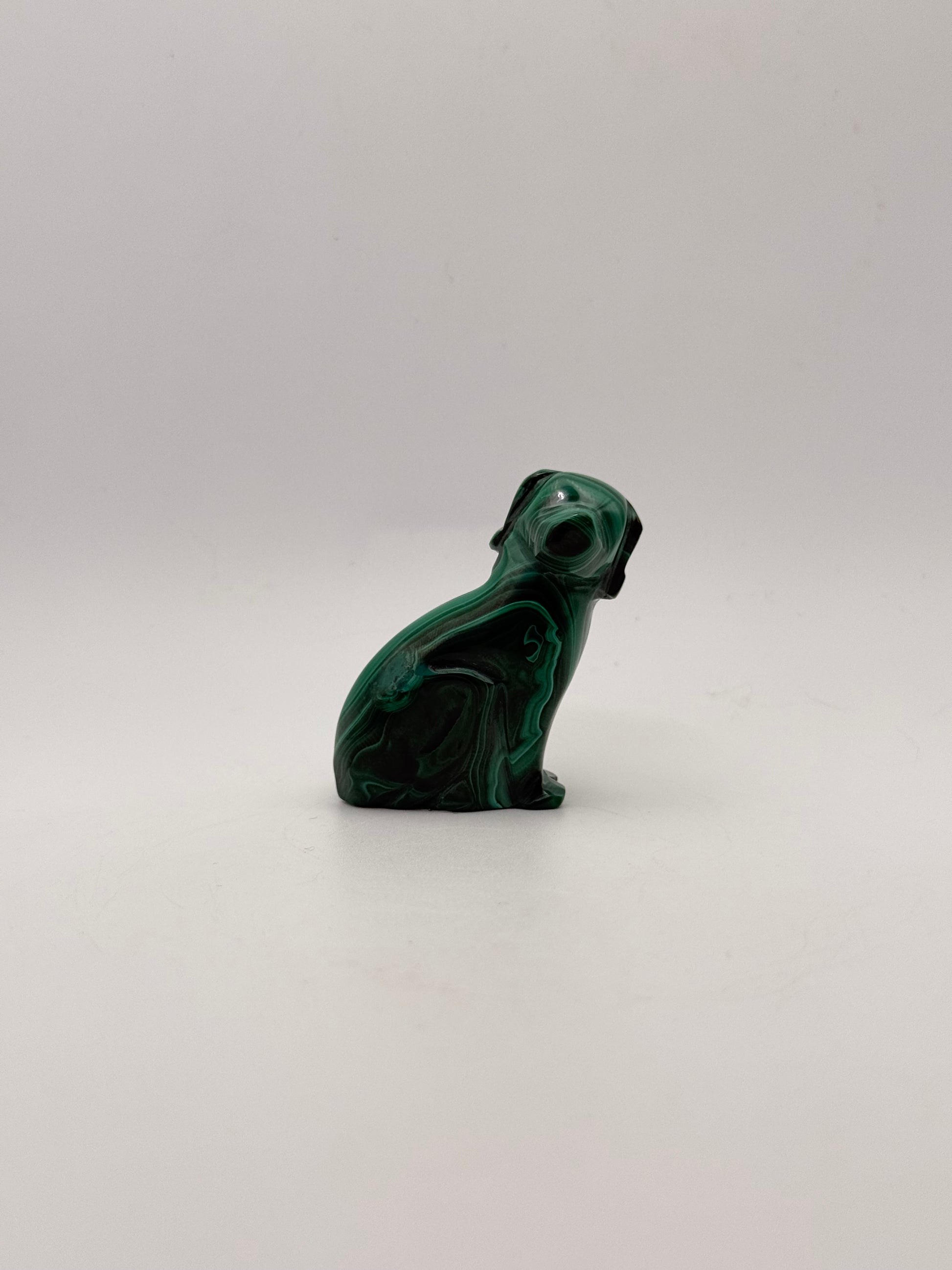 Polished malachite dog carving.