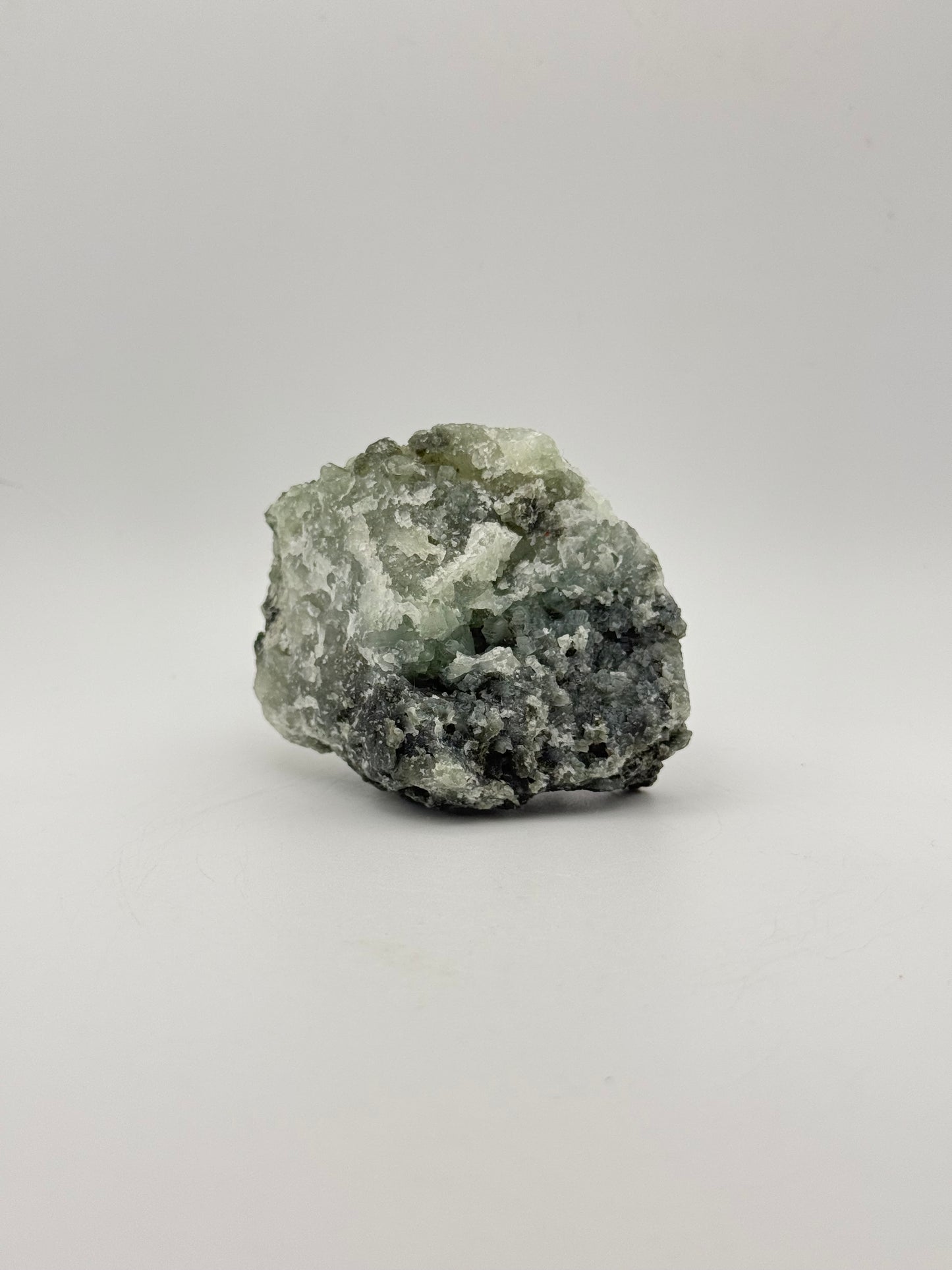 Raw Prehnite specimen with amazing green color.