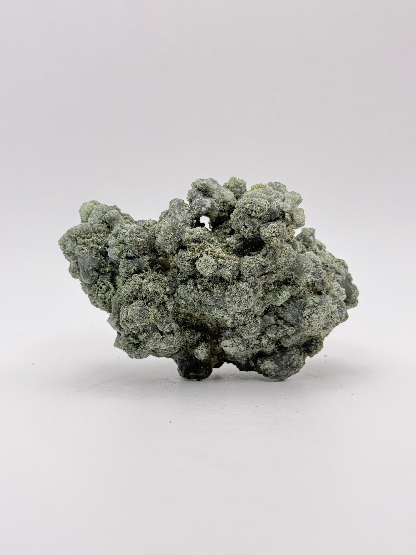 Raw prehnite specimen with amazing green color.