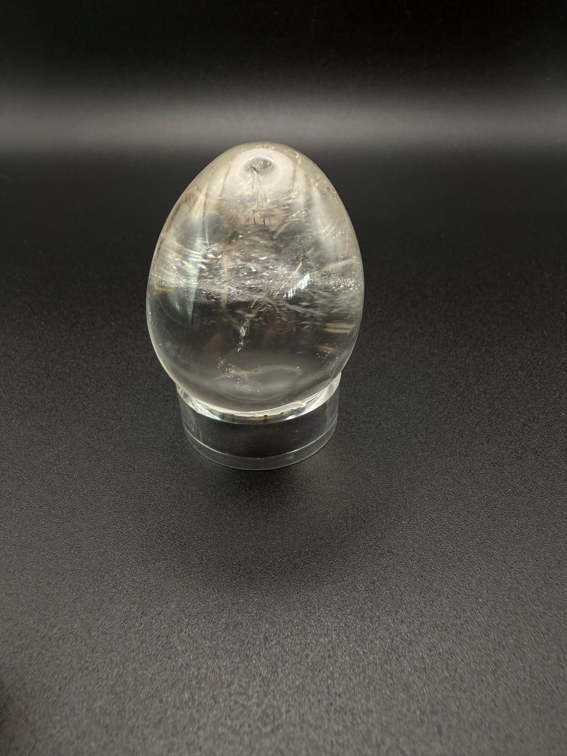 Clear quartz polished crystal in an egg shape.