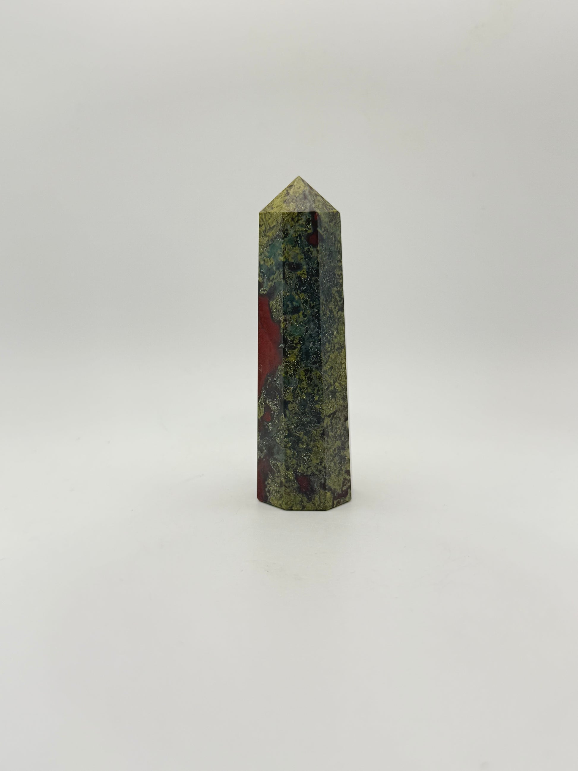 Polished Dragon Bloodstone in the shape of a tower.