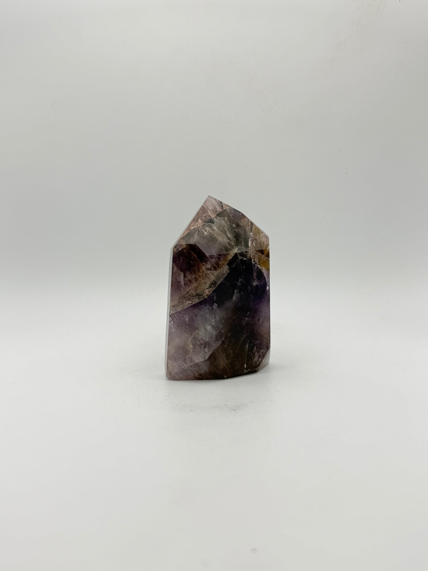 Polished super 7 in the shape of a tower.