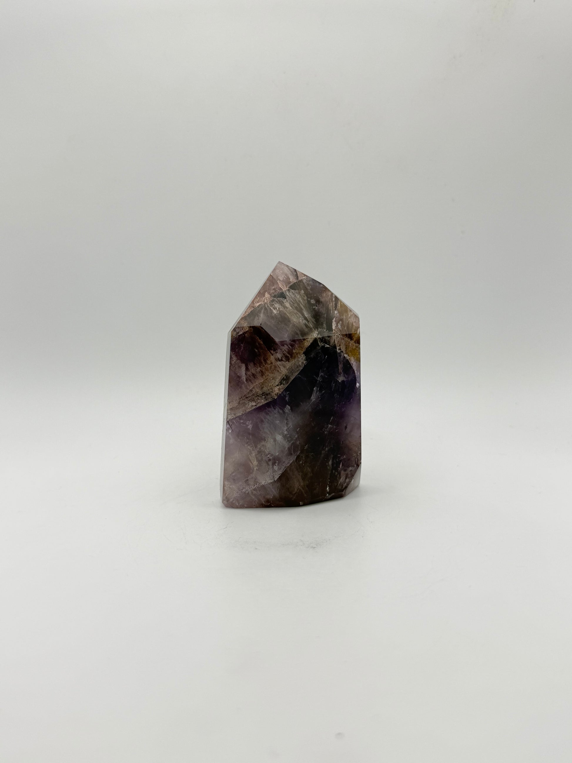 Polished super 7 in the shape of a tower.