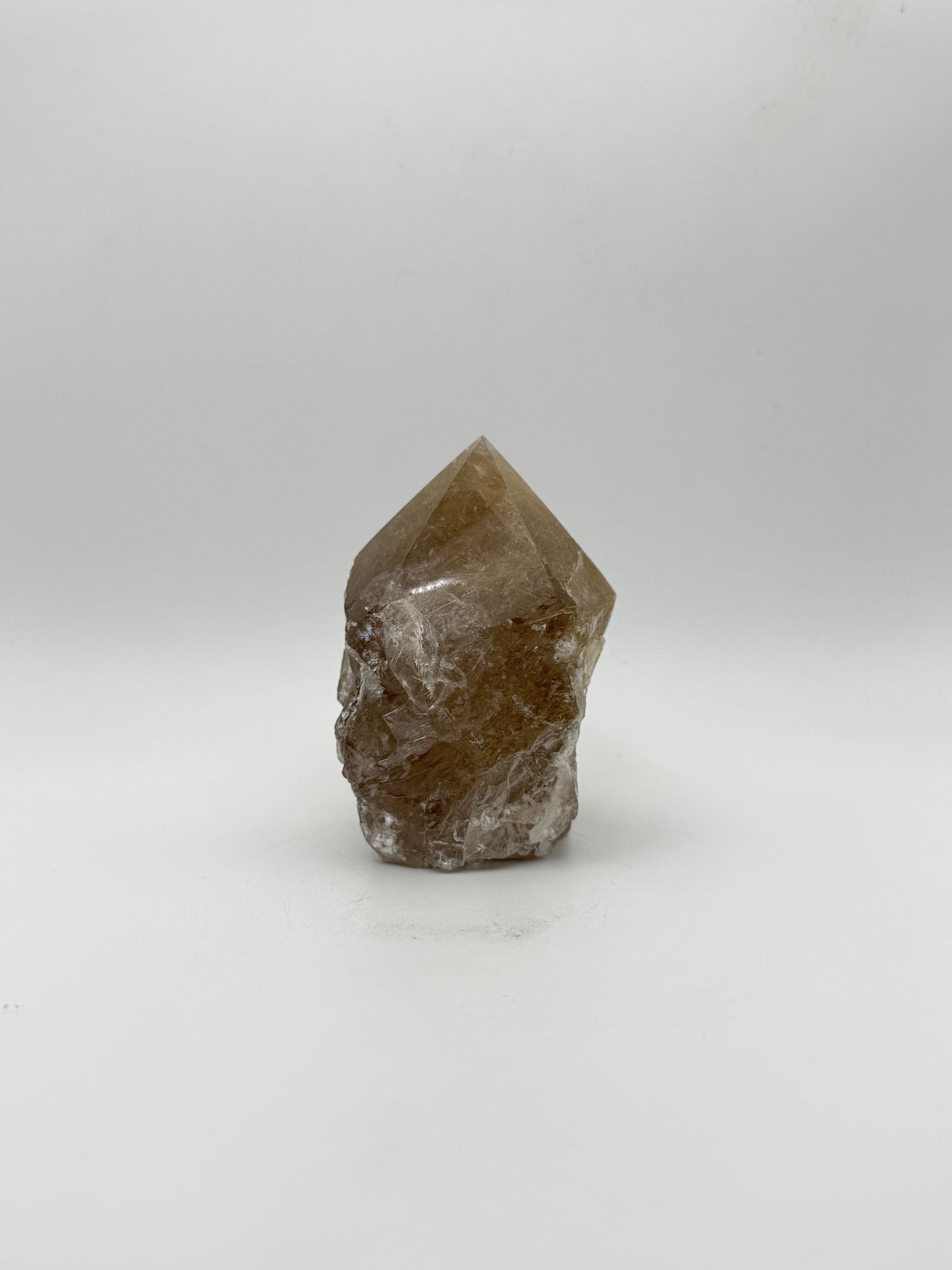 Smoky quartz tower with the top side polished and bottom natural.