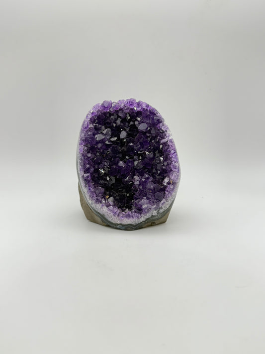 standing Amethyst cluster with deep purple crystals. about 3 1/2inches tall.
