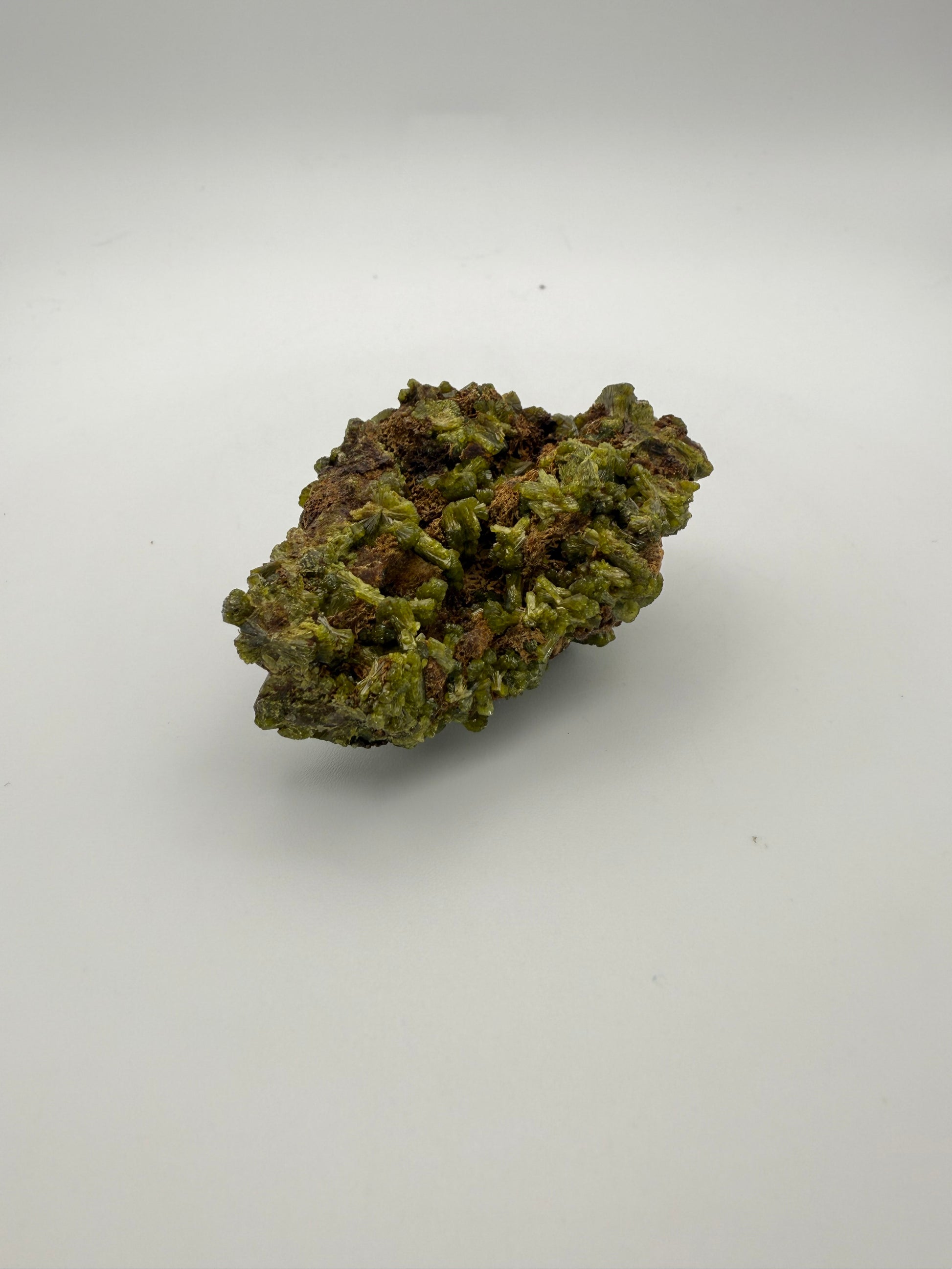 Epidote crystal cluster with good green color.