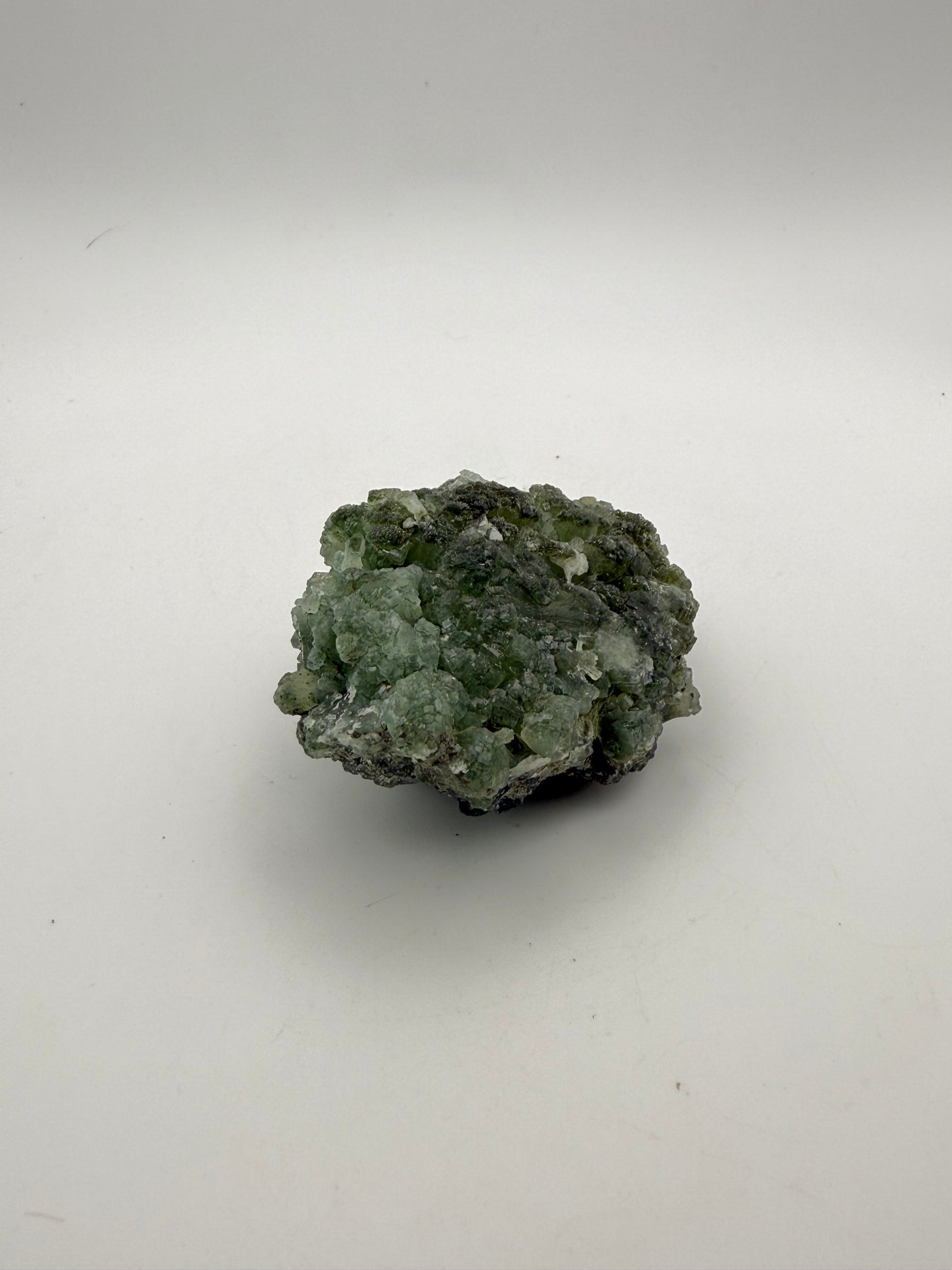 Raw Prehnite specimen with amazing green color.