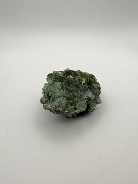 Raw Prehnite specimen with amazing green color.