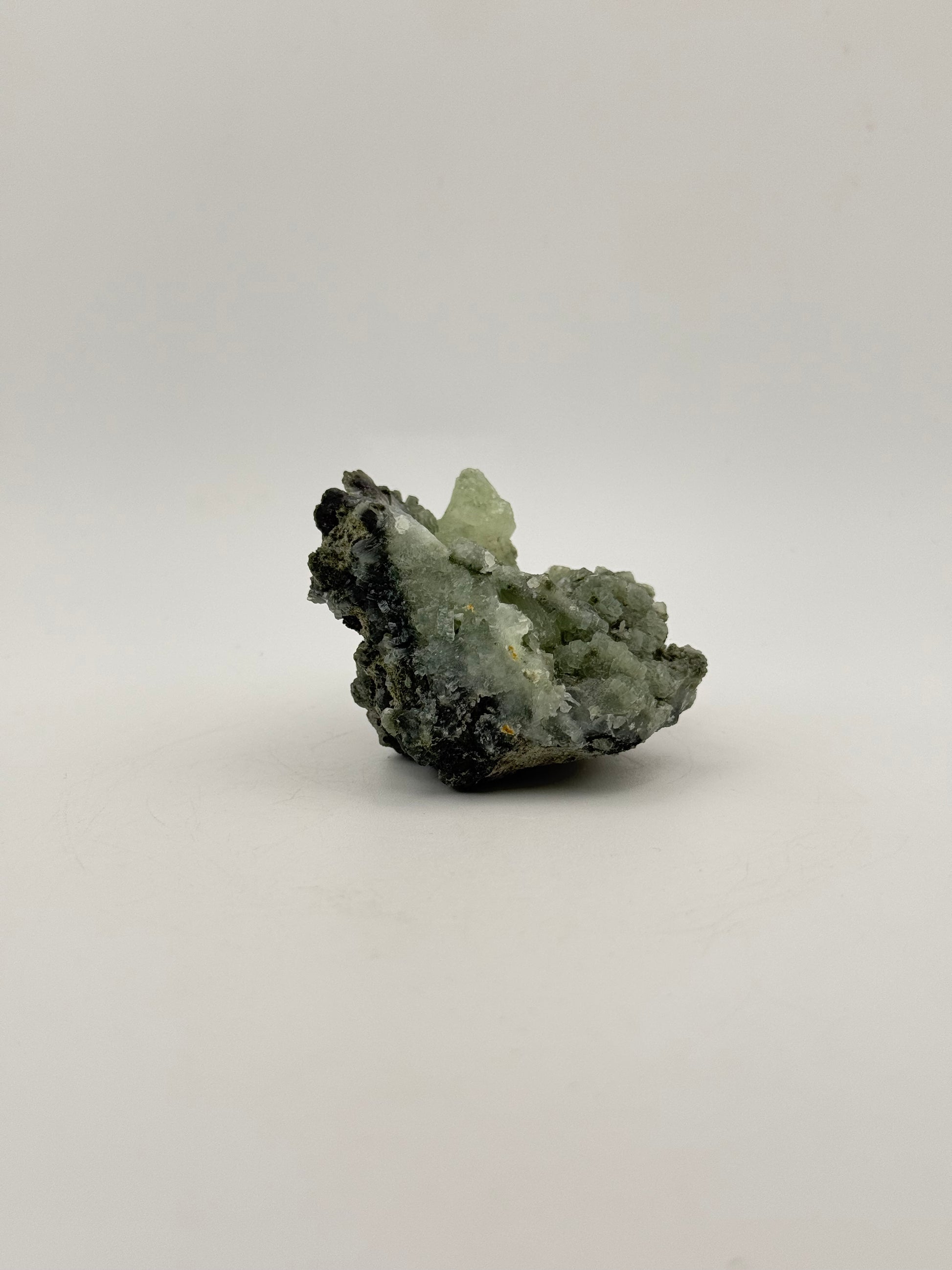 Raw Prehnite specimen with amazing green color.