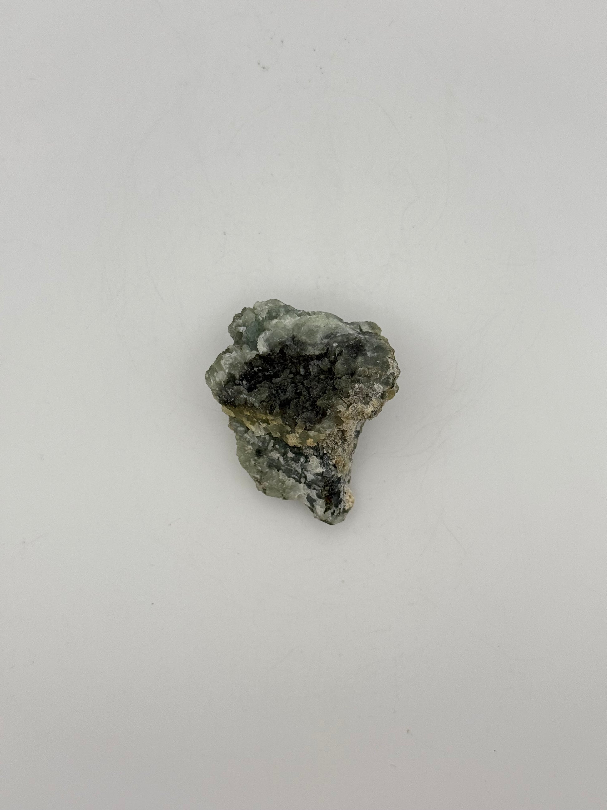 Raw prehnite specimen with amazing green color.