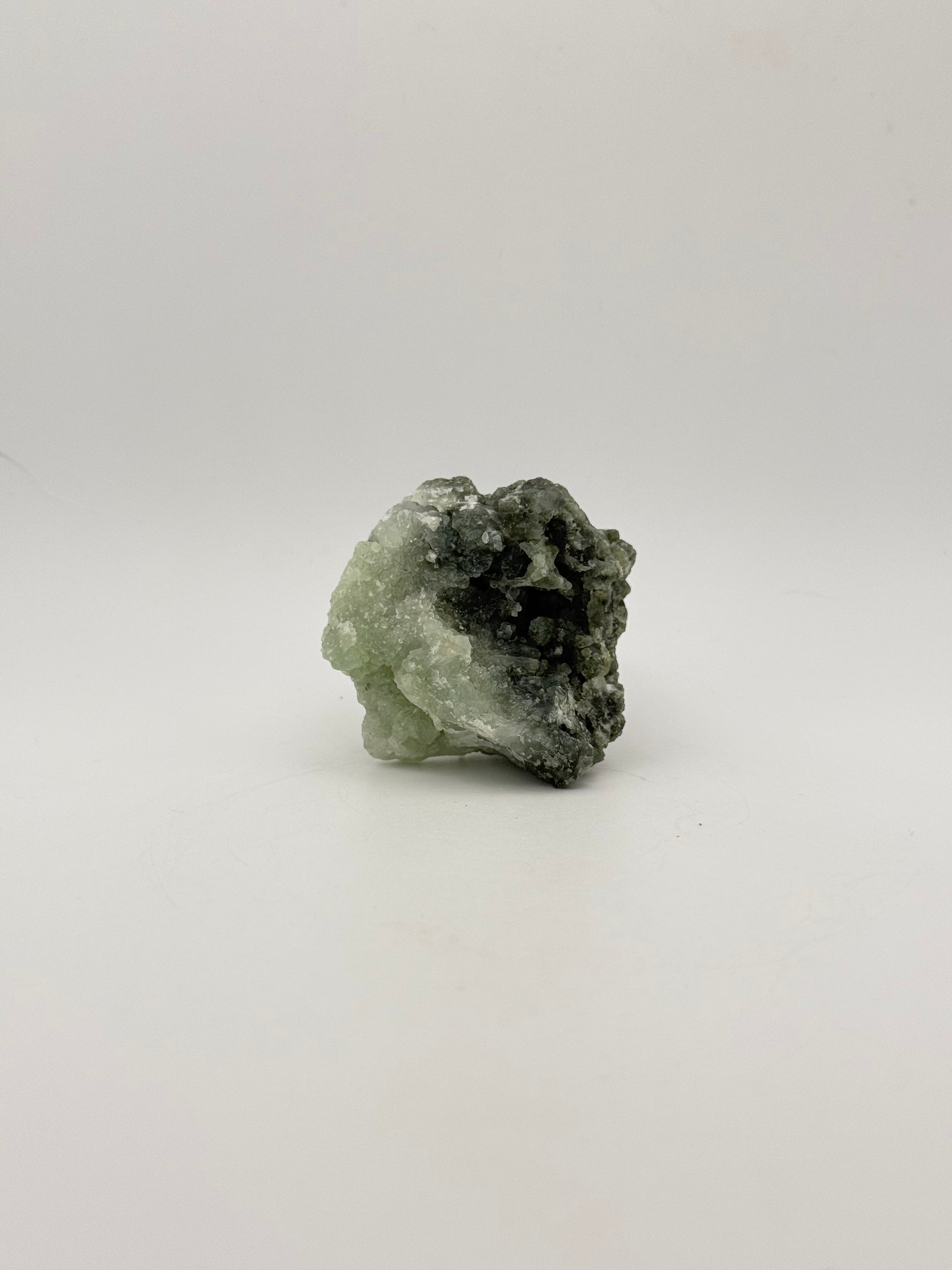 Raw Prehnite specimen with amazing green color.