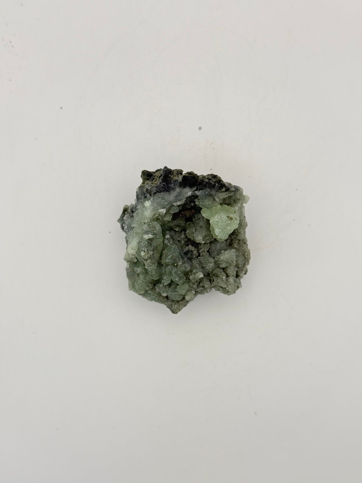 Raw Prehnite specimen with amazing green color.