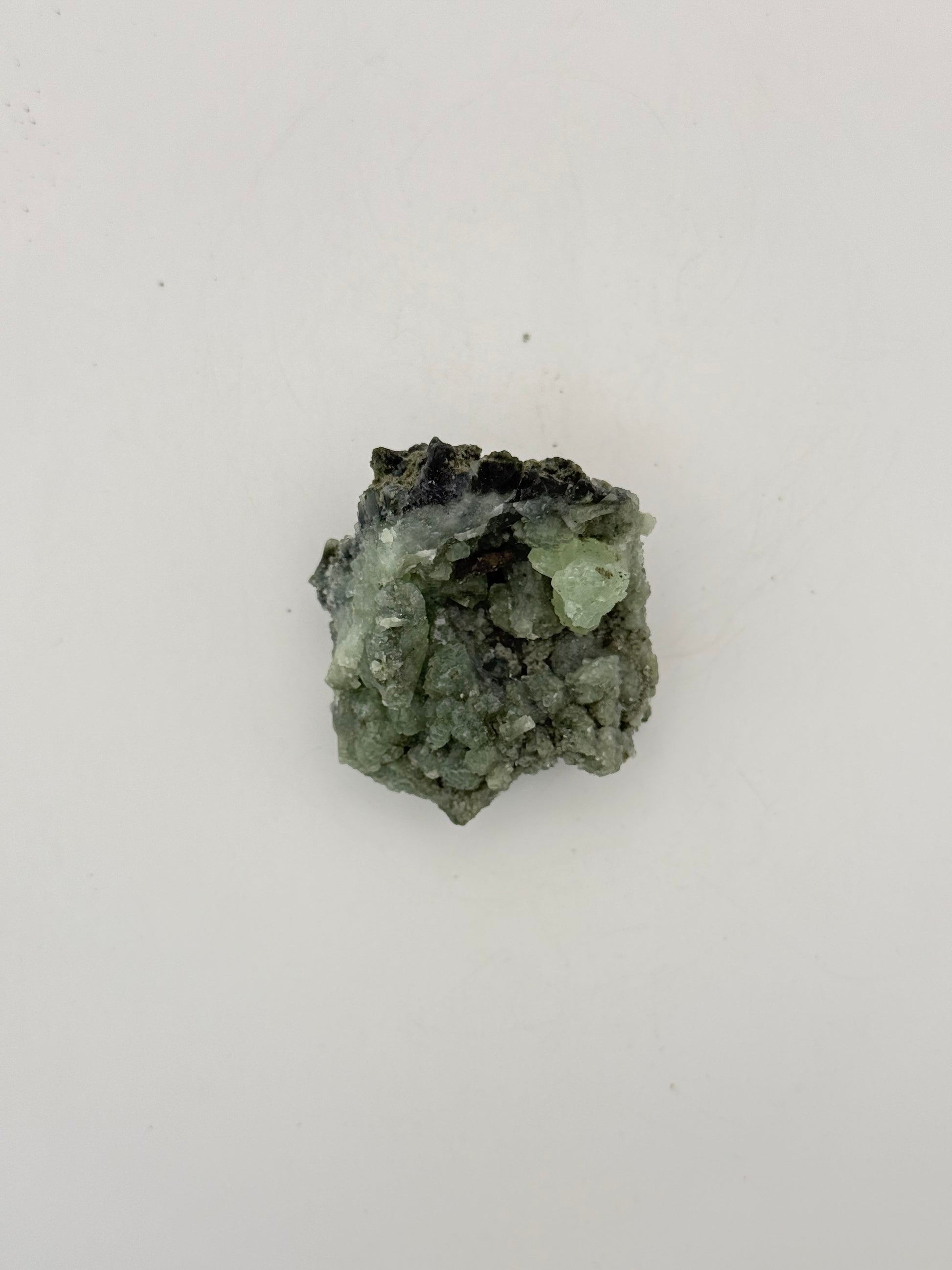 Raw Prehnite specimen with amazing green color.