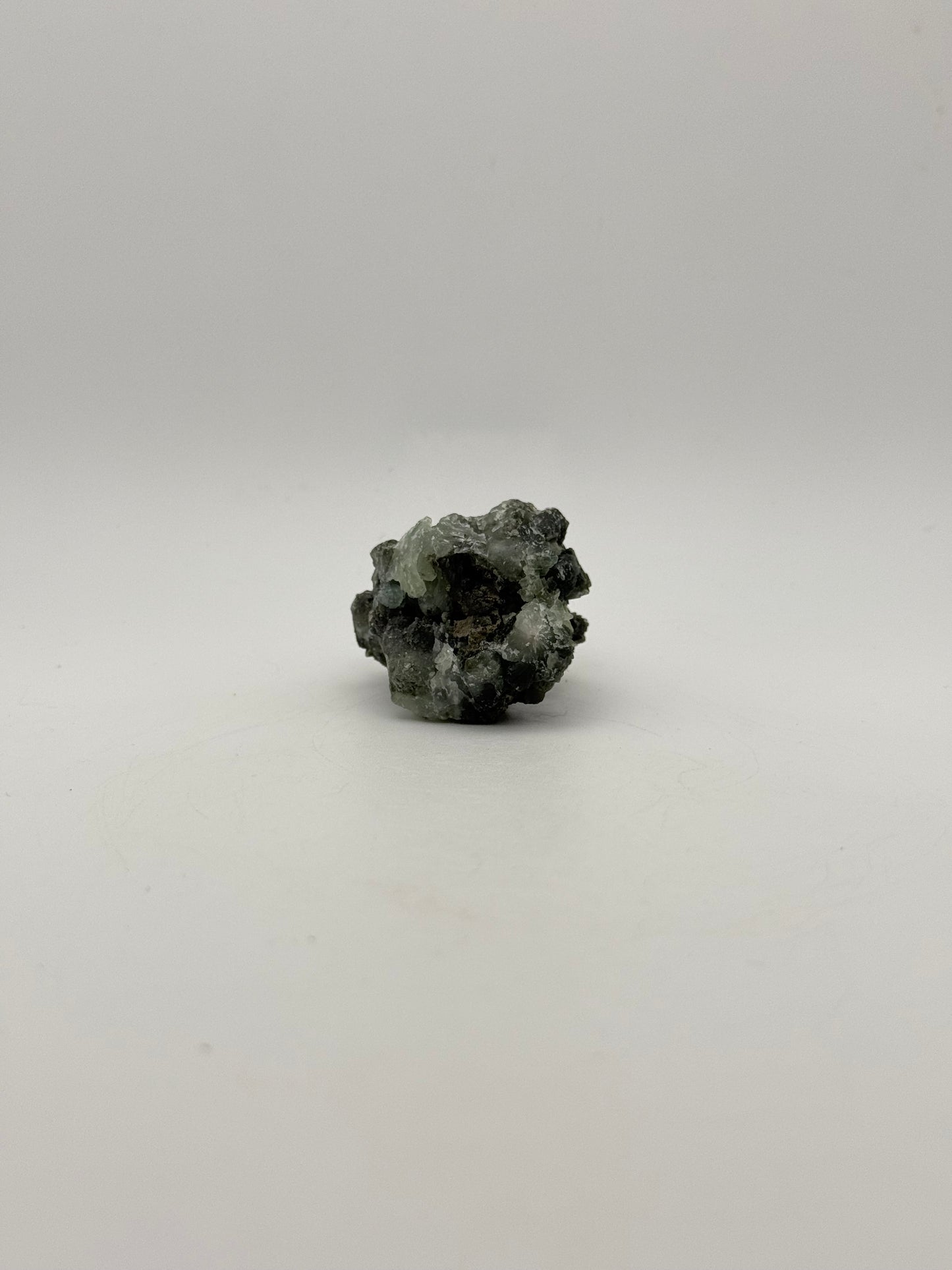 Raw prehnite specimen with amazing green color.