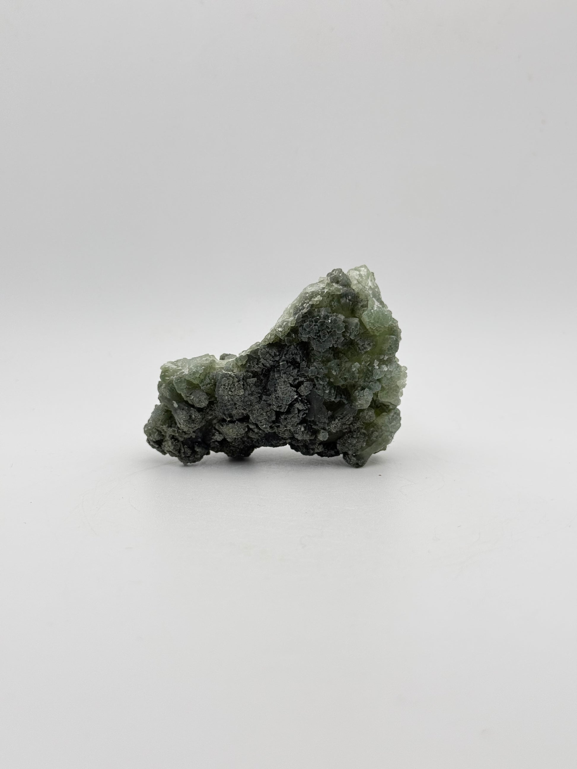 Raw Prehnite specimen with amazing green color.