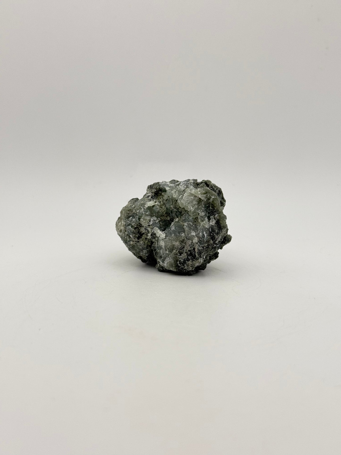 Raw prehnite specimen with amazing green color.