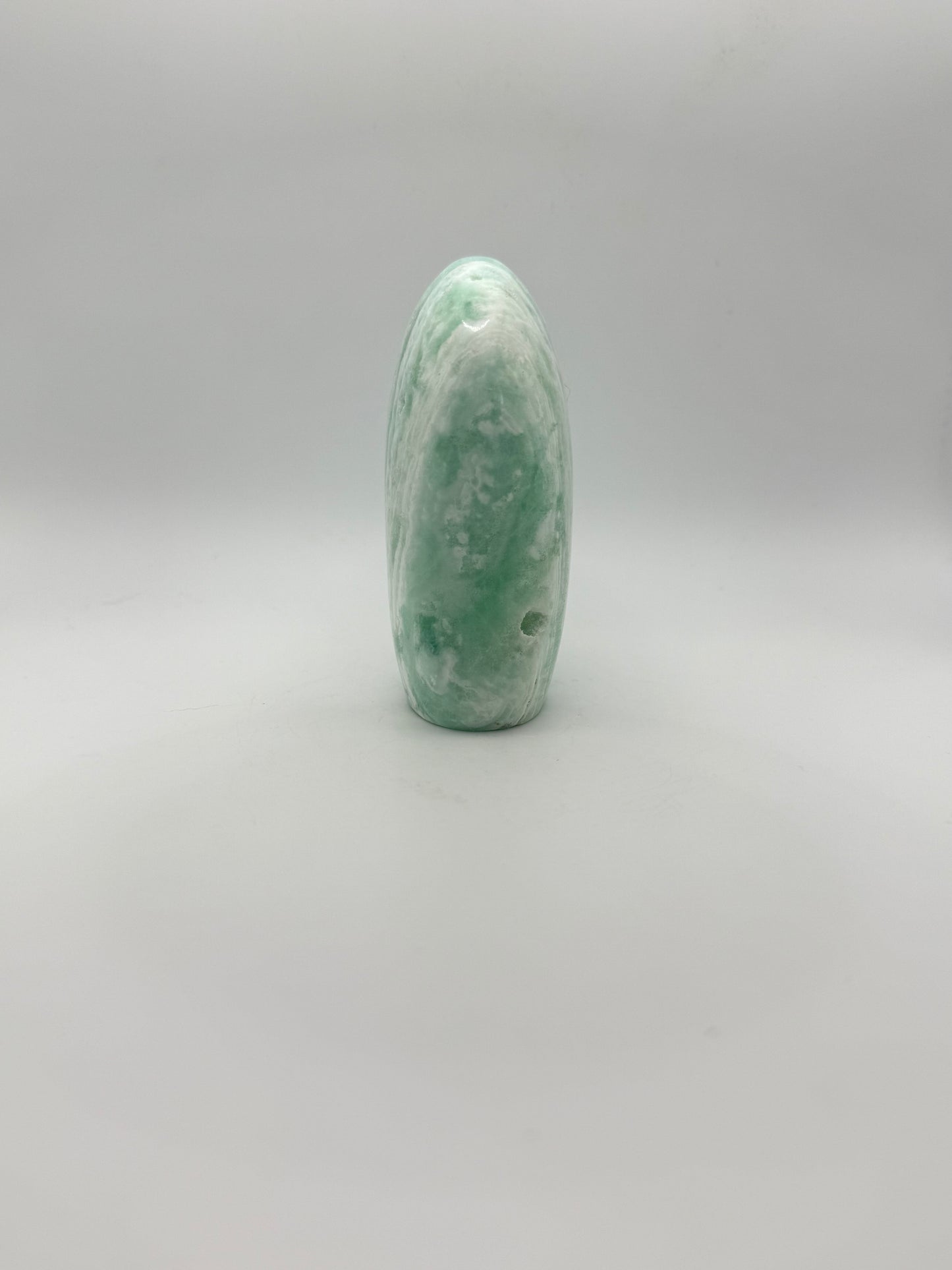 Caribbean calcite polished crystal free form in the shape of a dome.