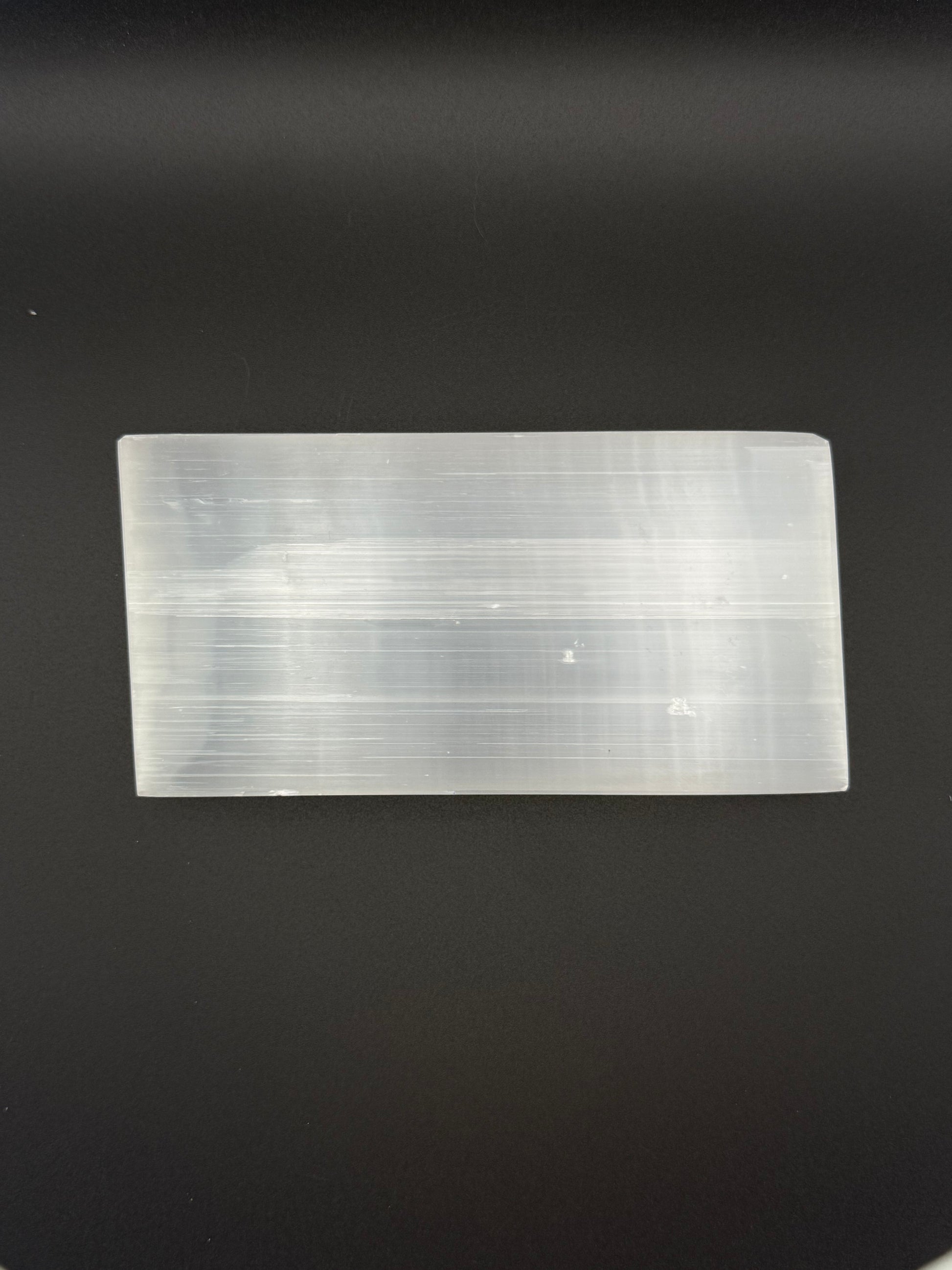 Selenite plate in the shape of a rectangle.