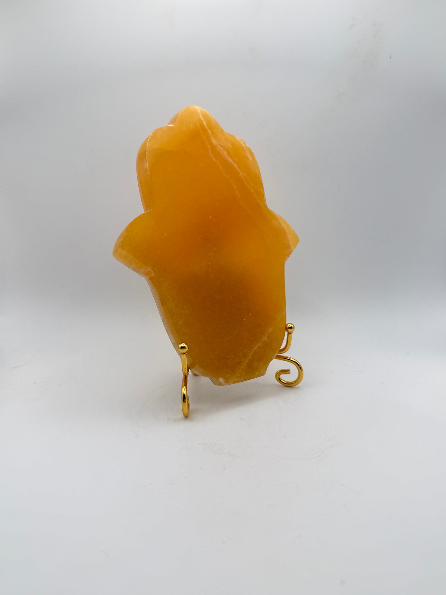 Polished Orange calcite hasma carving.