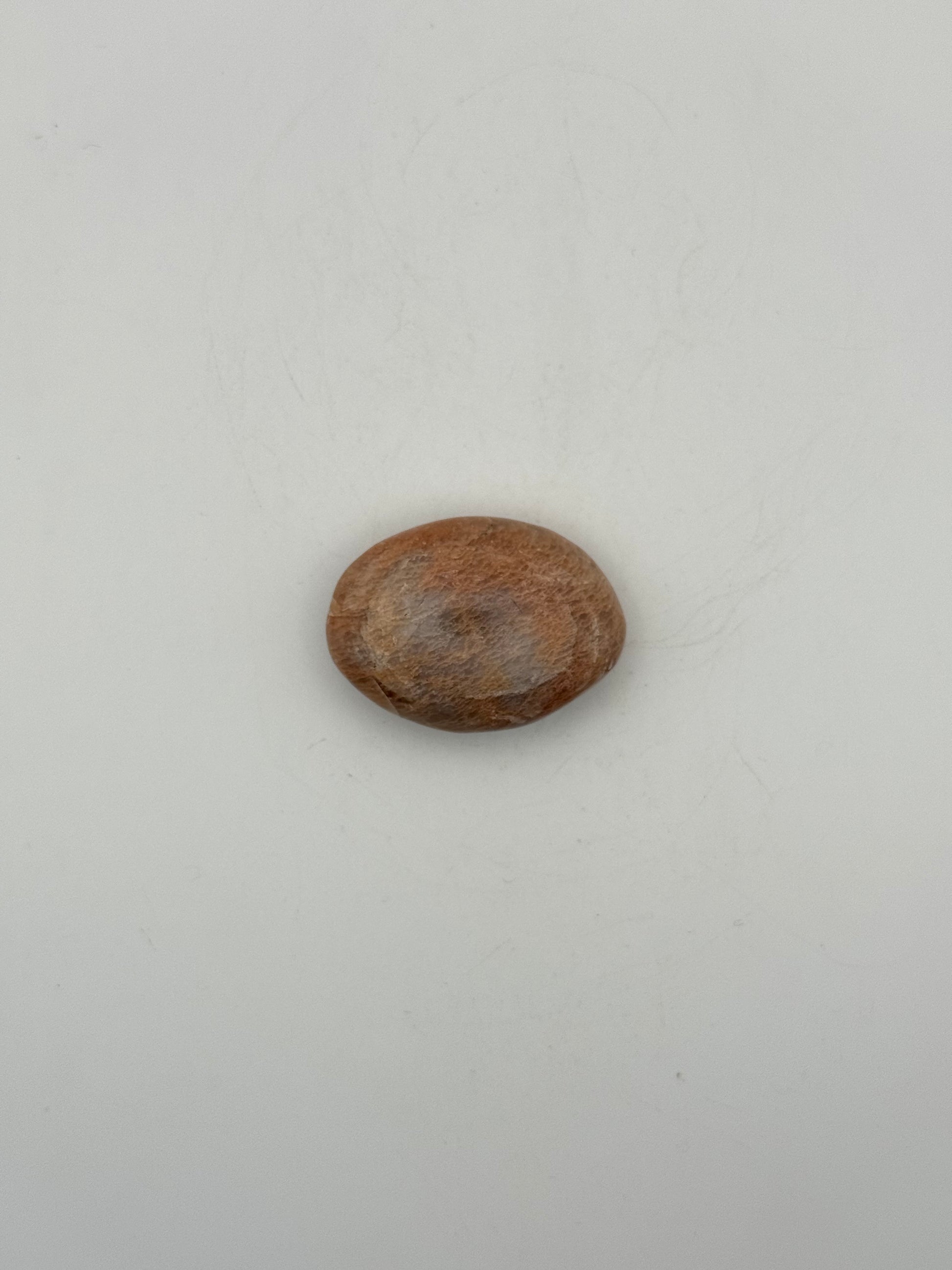 Polished Peach moonstone palm stone.
