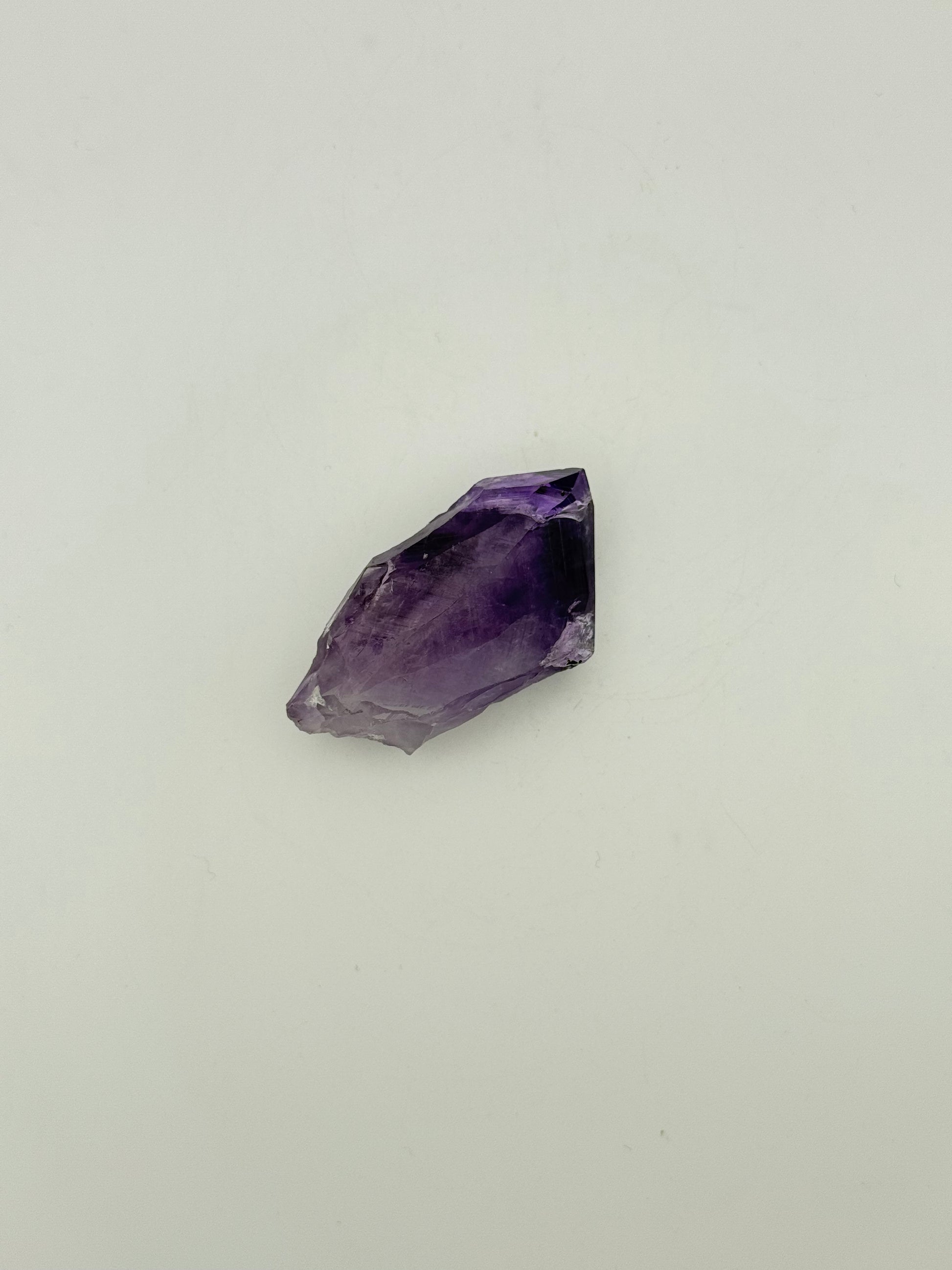 Amethyst crystal with deep purple color.