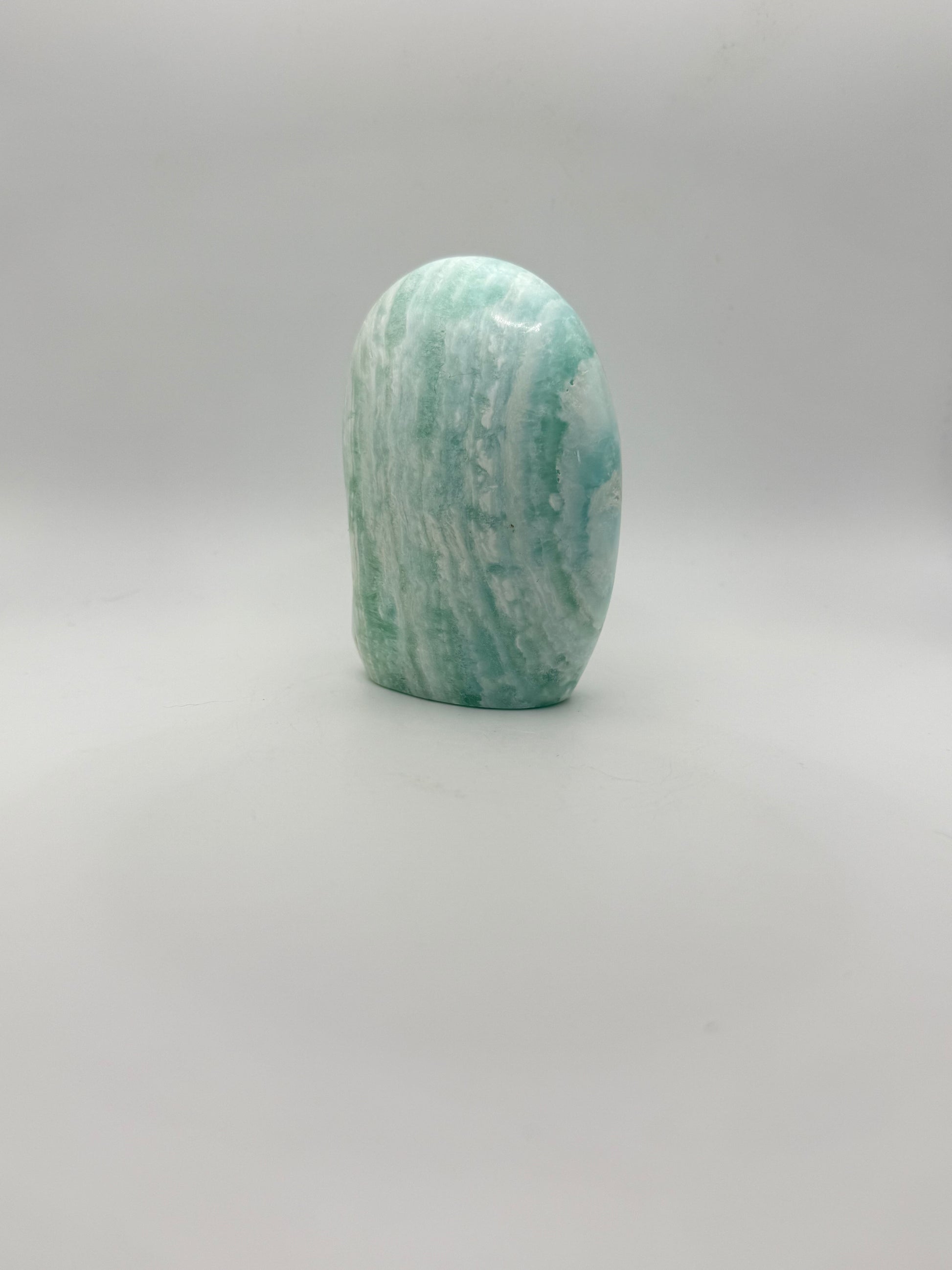 Caribbean calcite polished crystal free form in the shape of a dome.