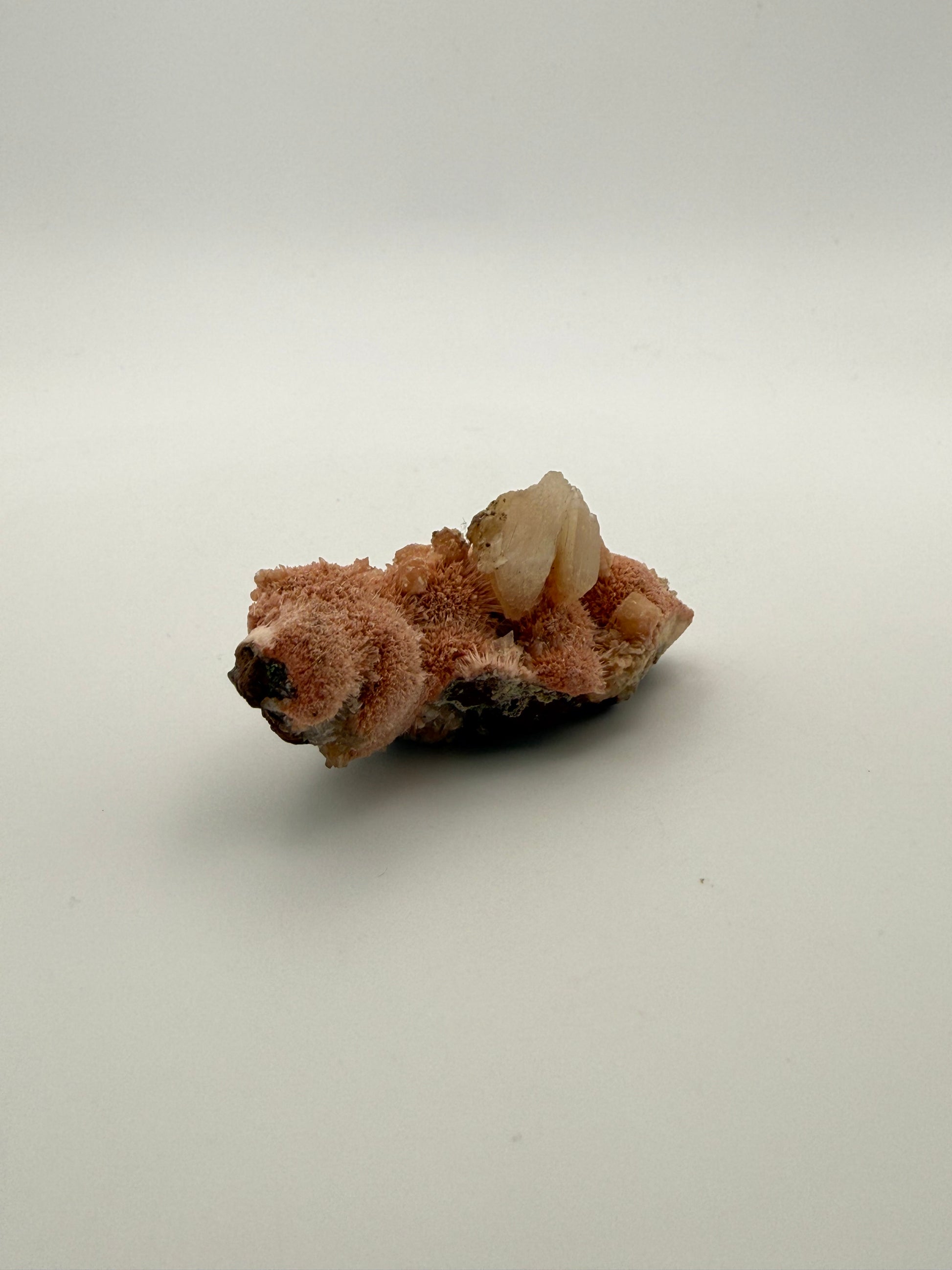 Raw Messolite crystal.