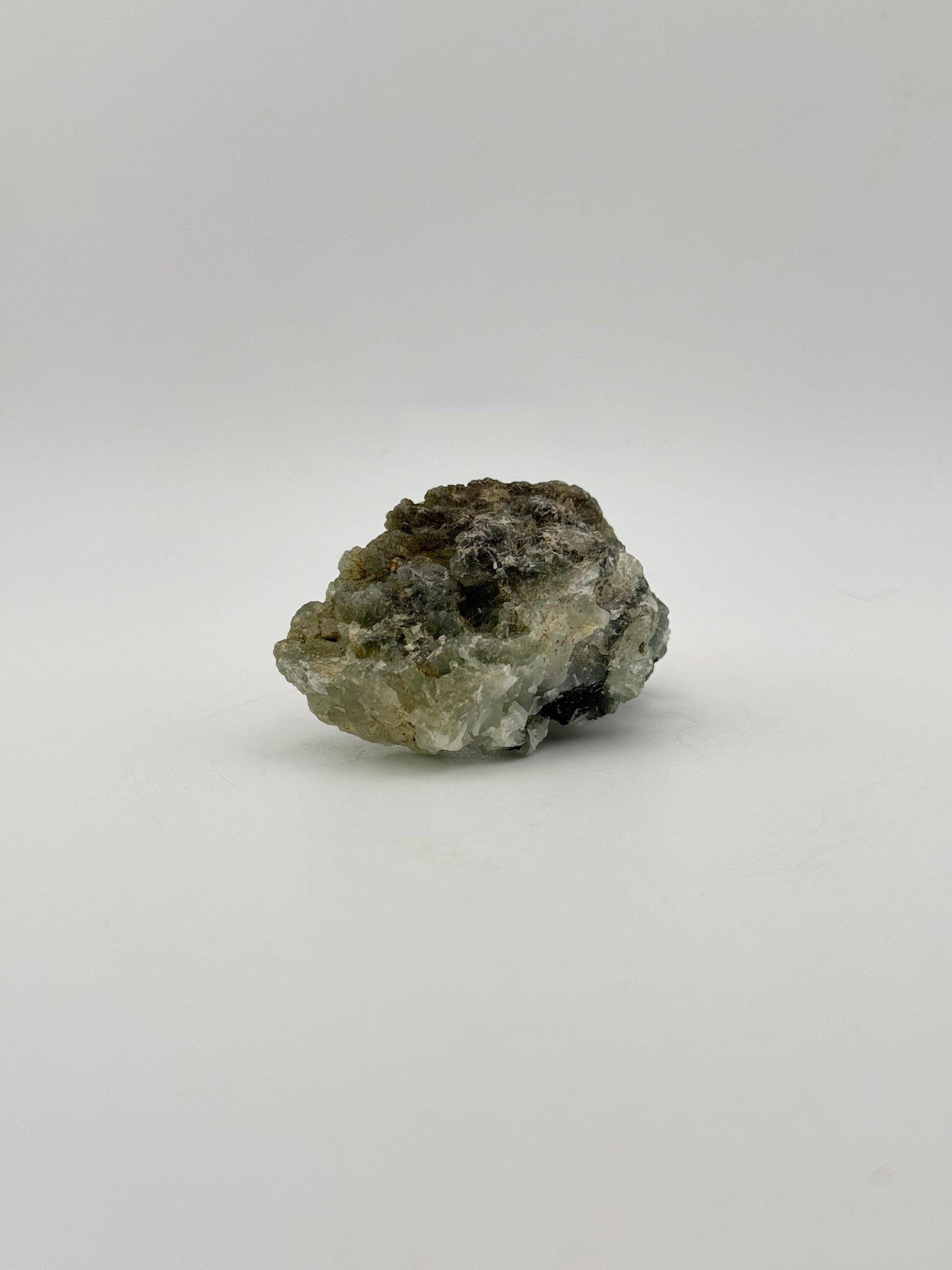 Raw Prehnite specimen with amazing green color.