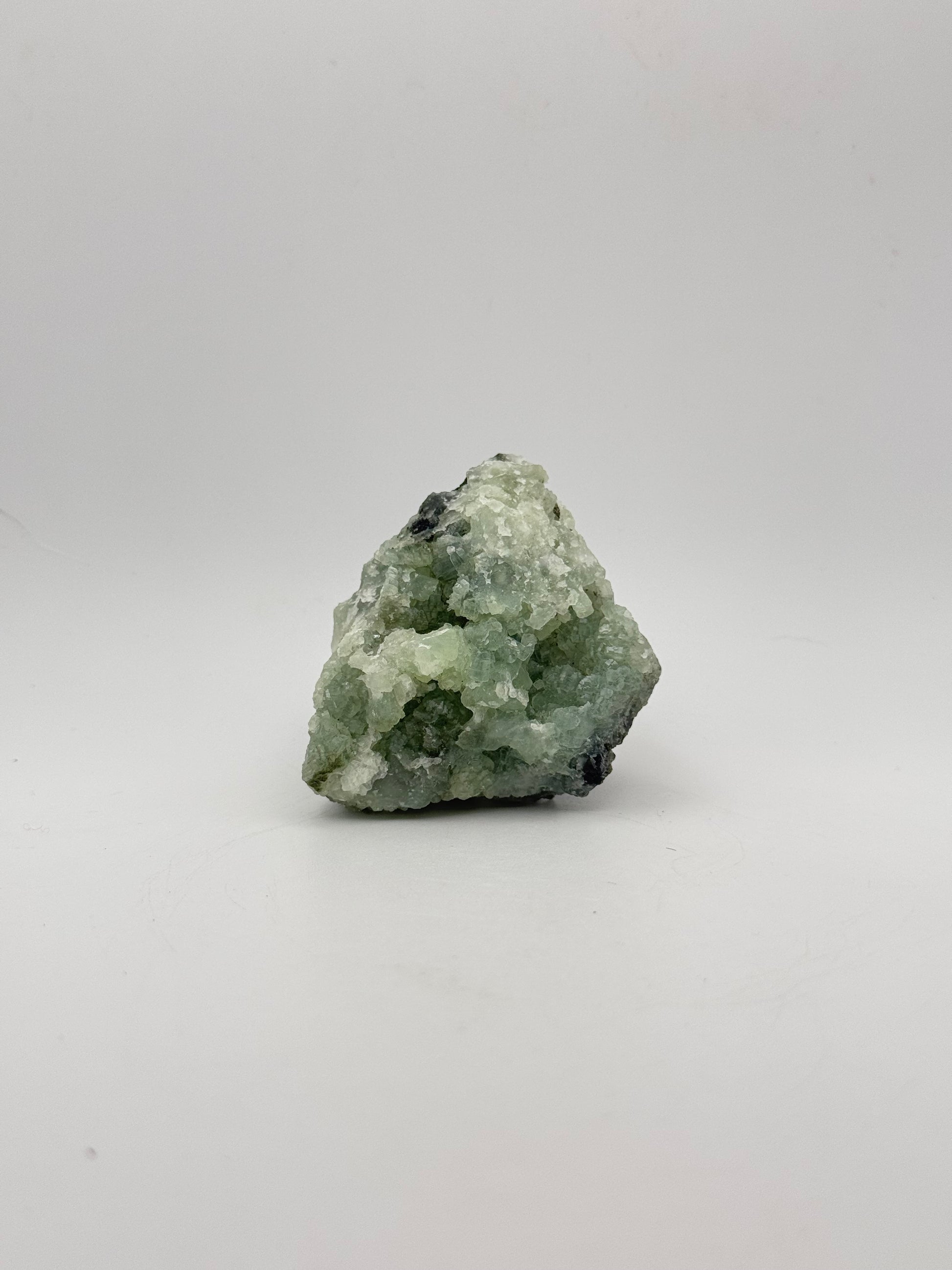 Raw Prehnite specimen with amazing green color.