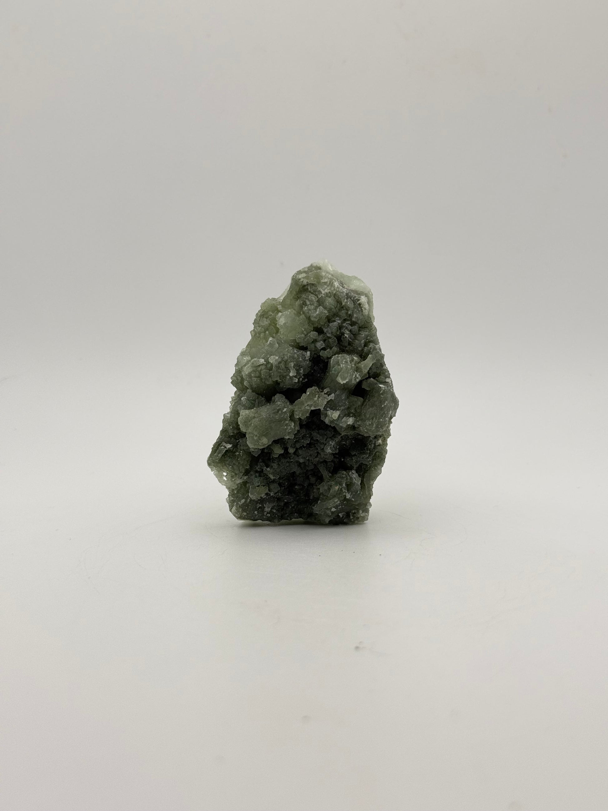 Raw Prehnite specimen with amazing green color.