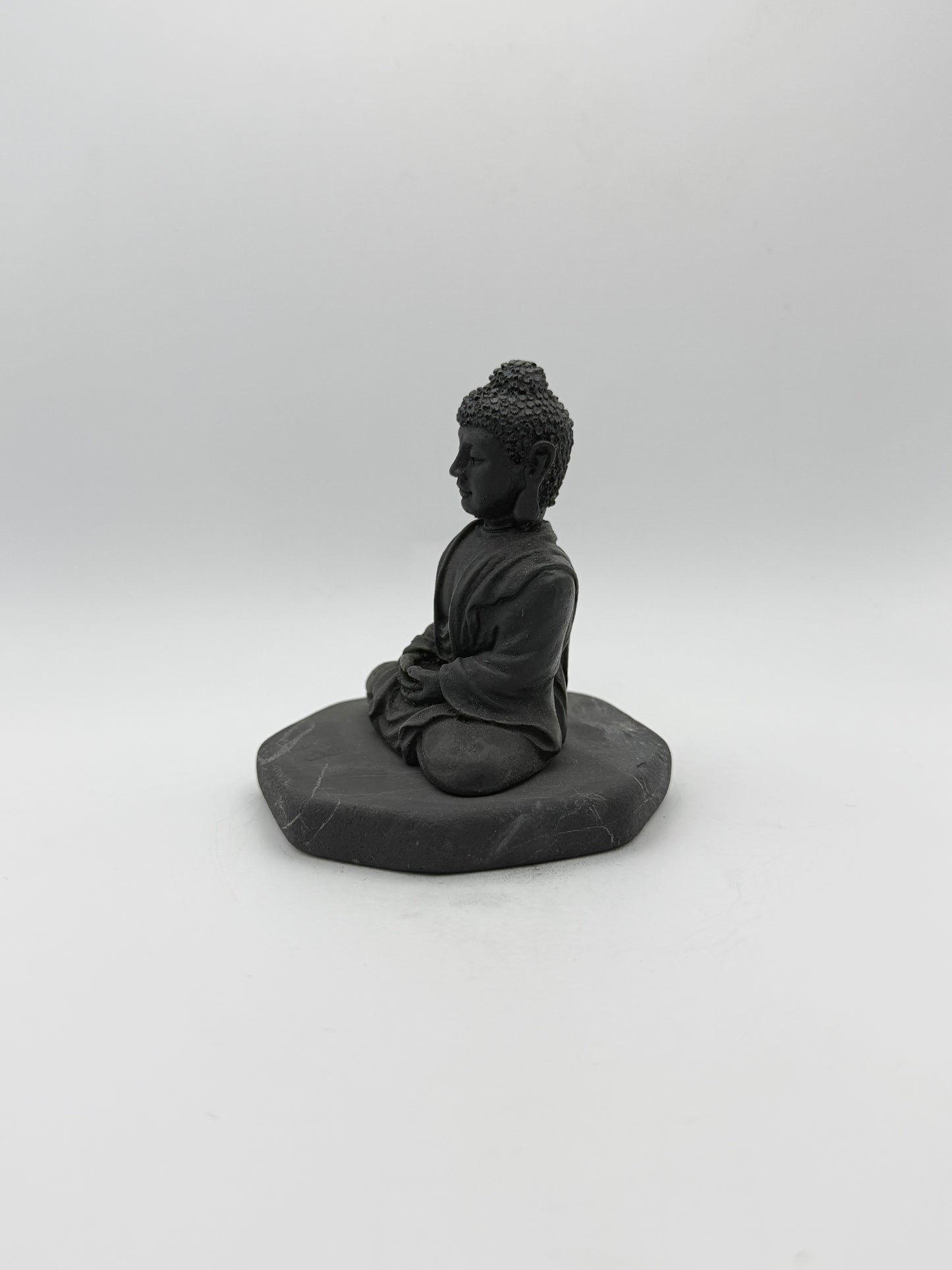 Shungite carving of a buddha.
