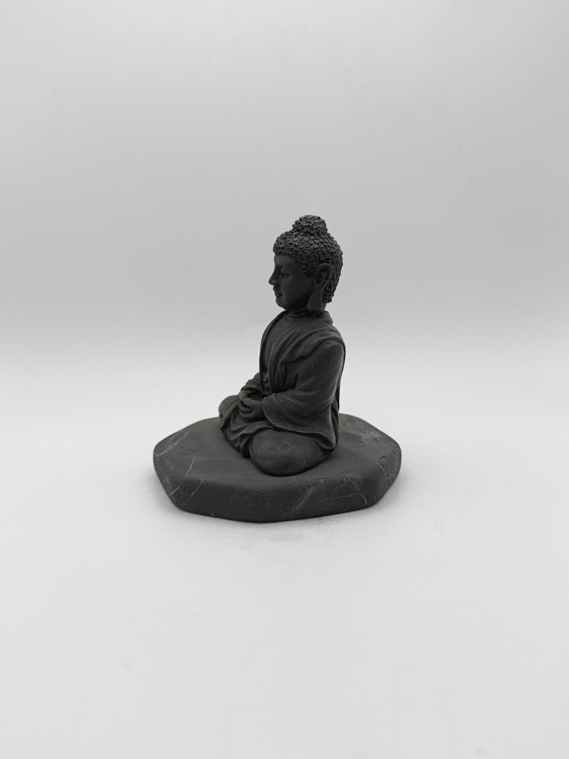 Shungite carving of a buddha.