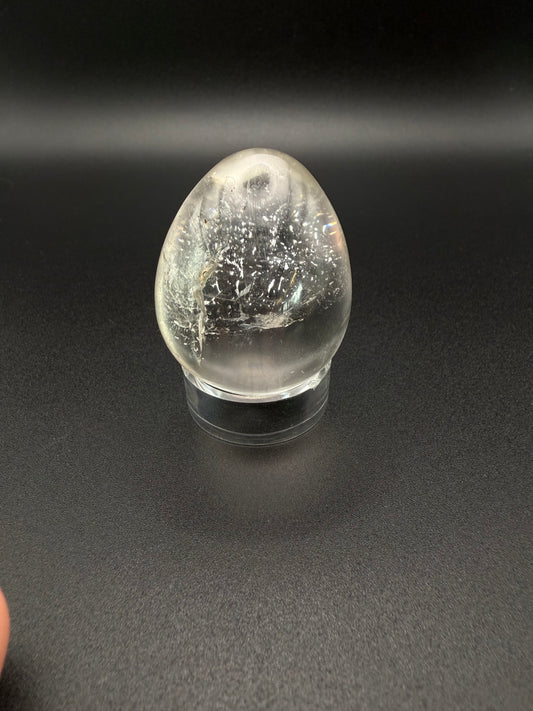 Clear quartz polished crystal in an egg shape.
