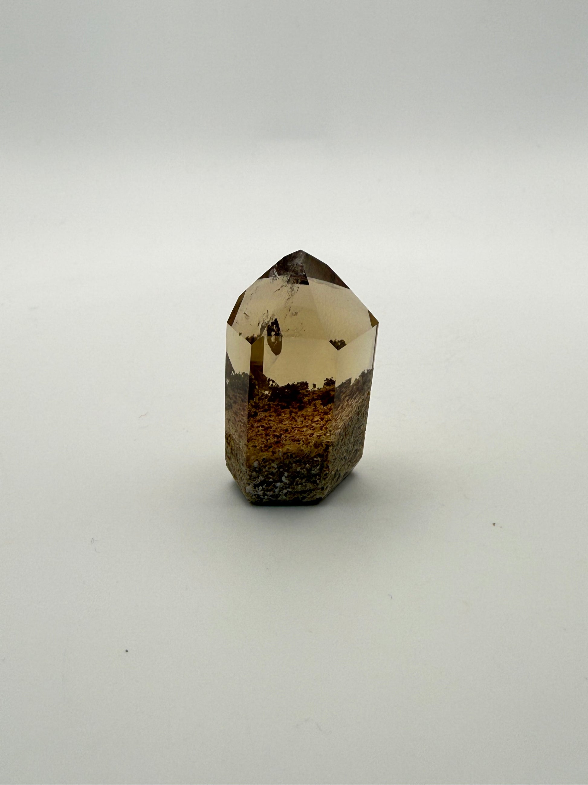 Polished natural citrine point.