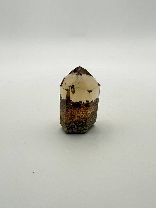 Polished natural citrine point.