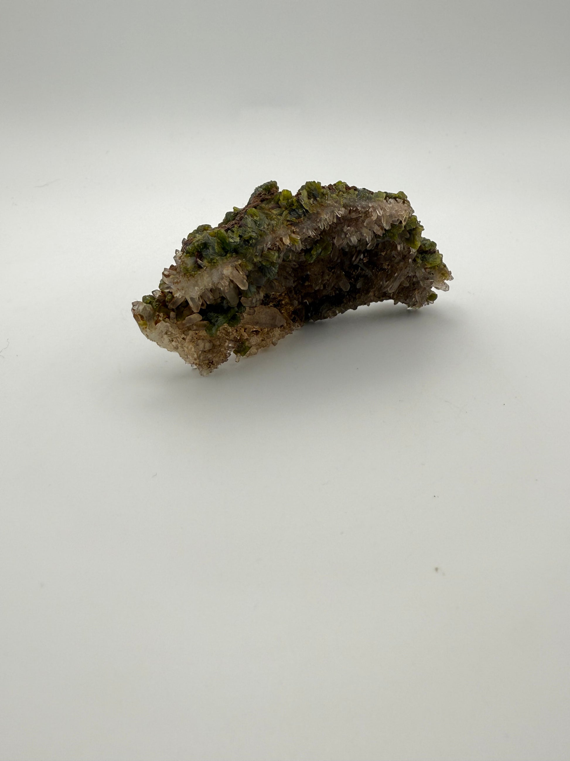 Epidote crystal cluster with good green color as well as quartz.