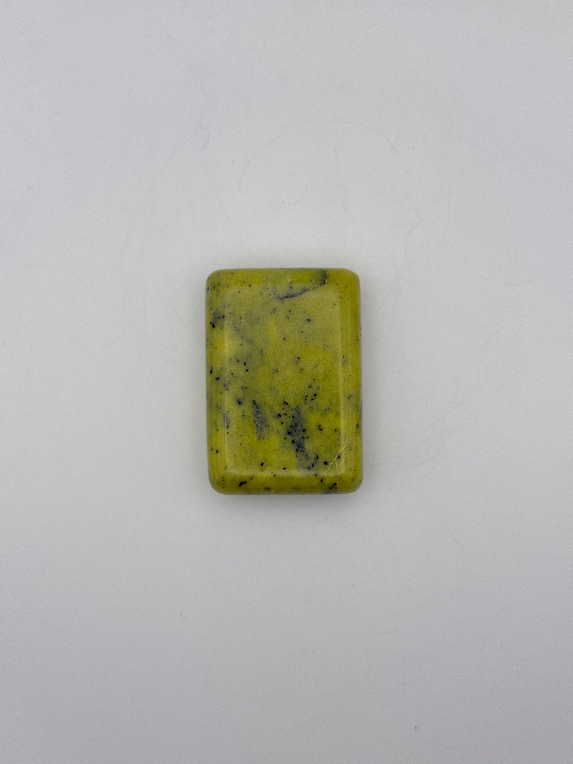 Polished healerite in the shape of a rectangular soap.