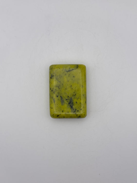 Polished healerite in the shape of a rectangular soap.