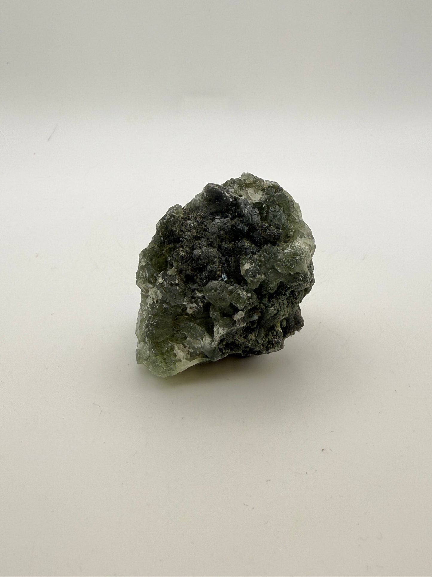 Raw Prehnite specimen with amazing green color.