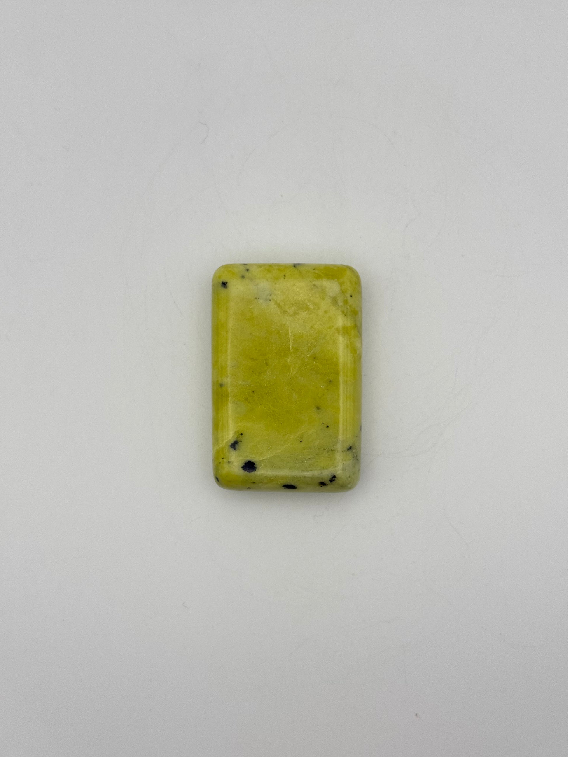 Polished healerite in the shape of a rectangular soap.