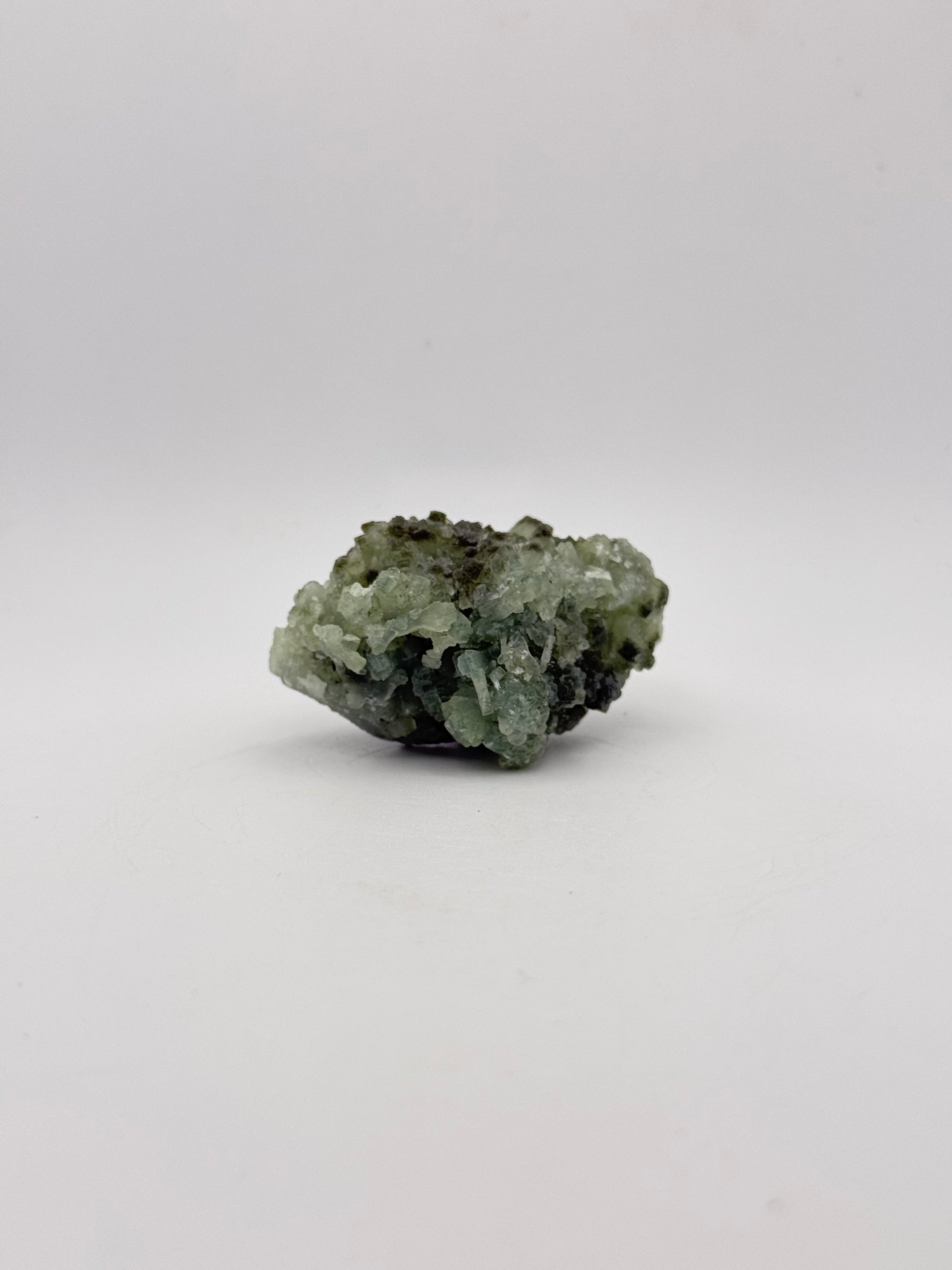 Raw Prehnite specimen with amazing green color.