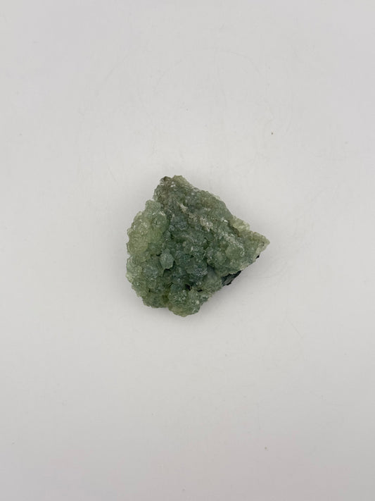 Raw Prehnite specimen with amazing green color.
