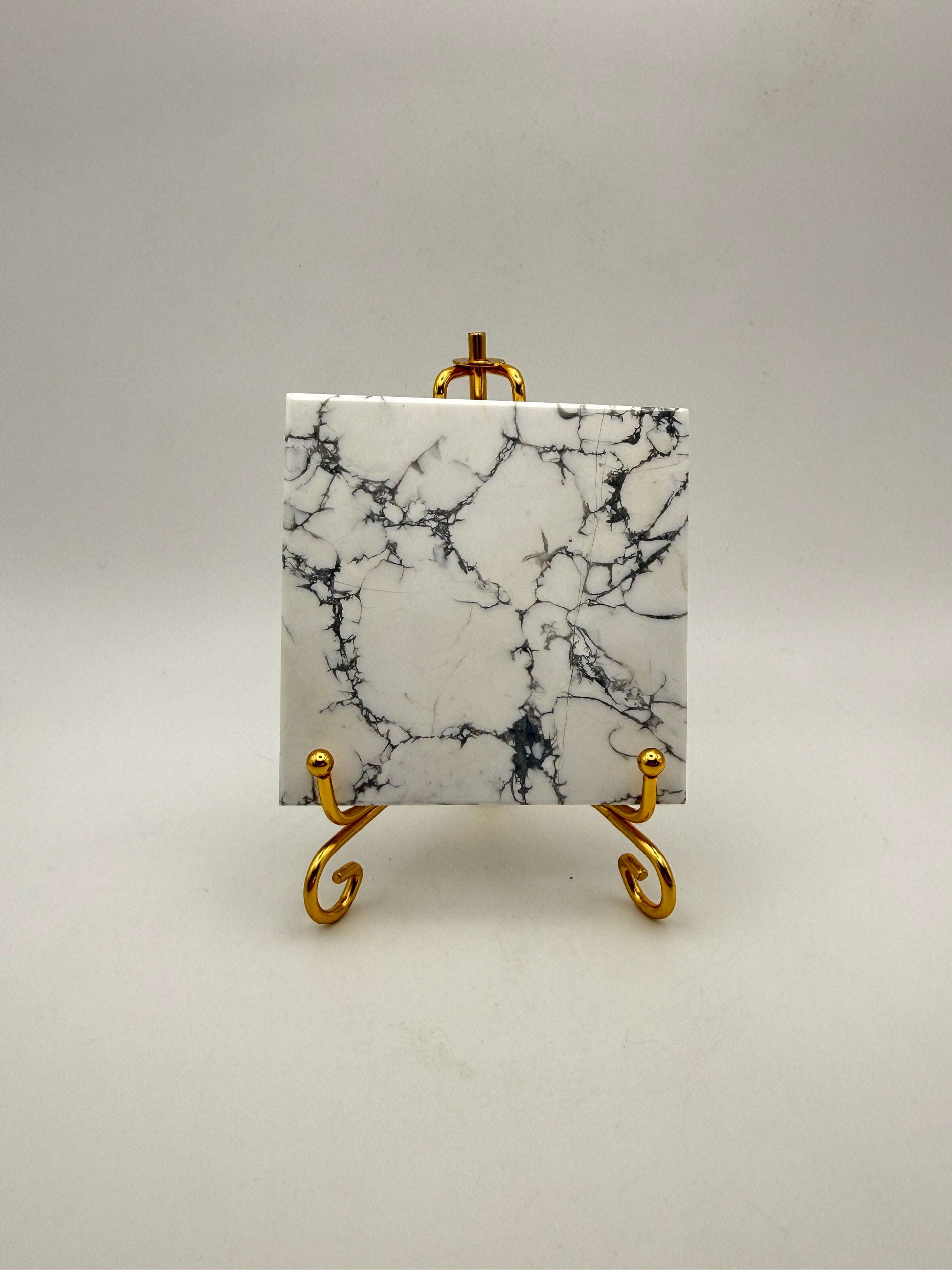 Polished howlite square tile.