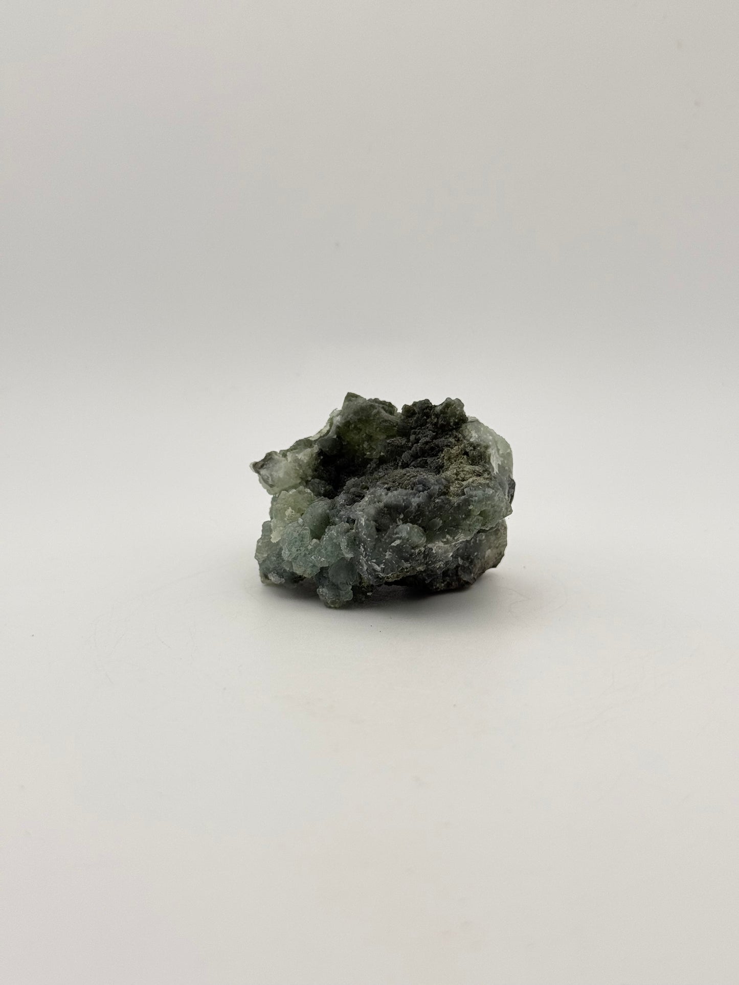 Raw Prehnite specimen with amazing green color.