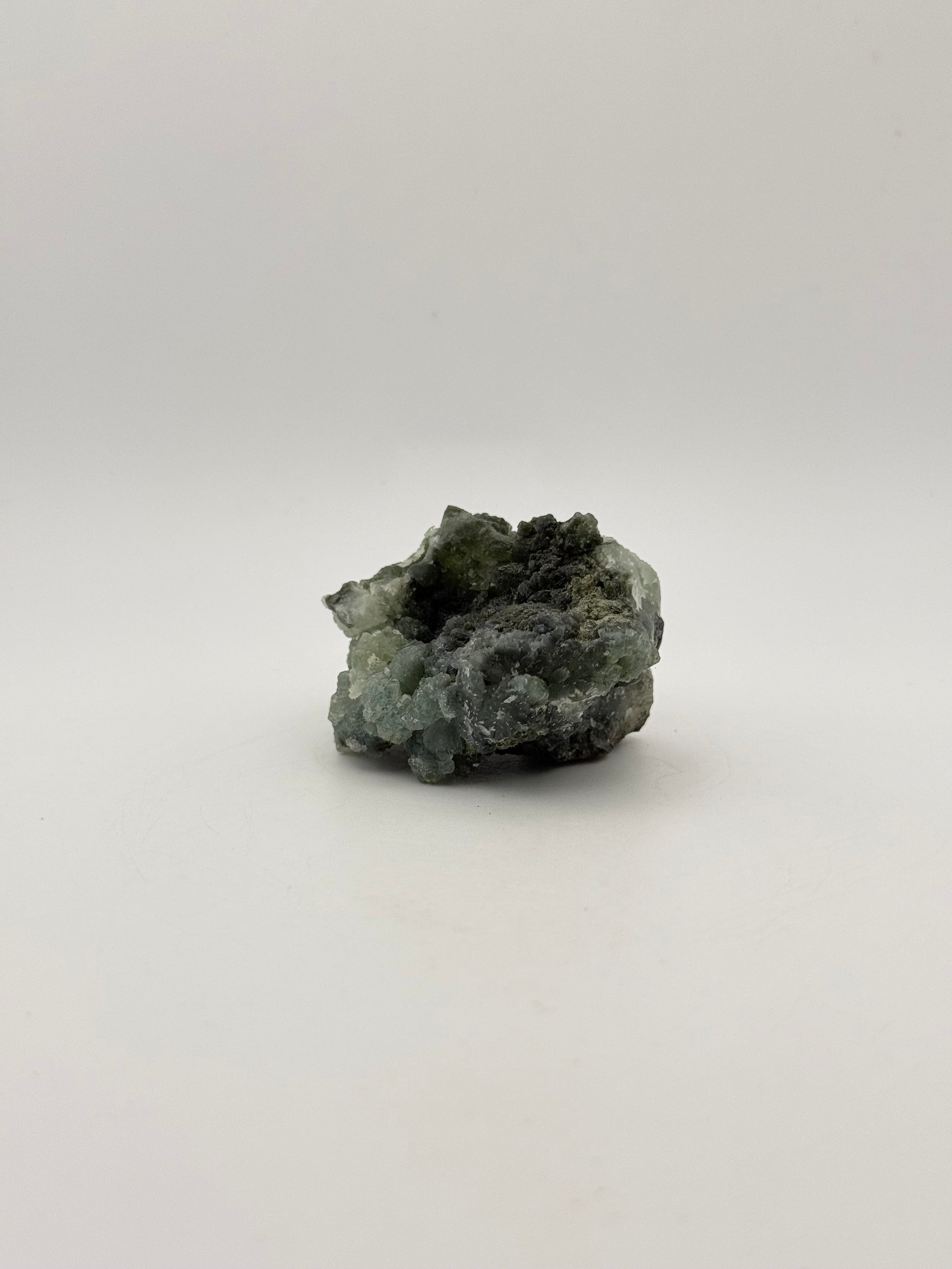 Raw Prehnite specimen with amazing green color.