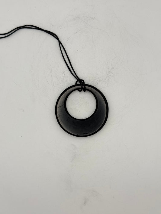 Shungite circle in circle pendant.