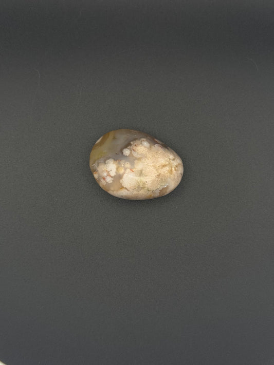 Flower agate polished crystal palm stone.