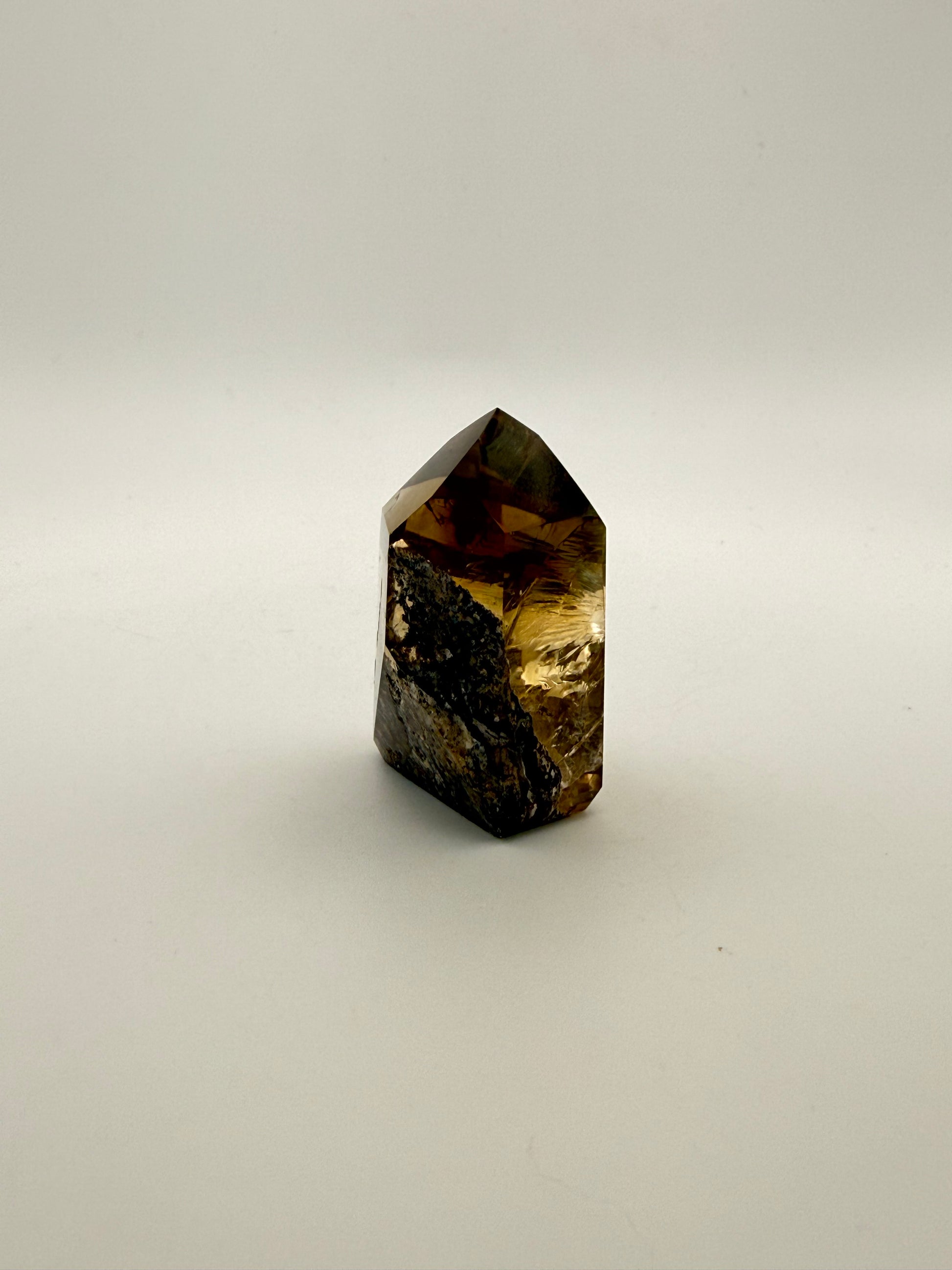 Polished natural citrine point.