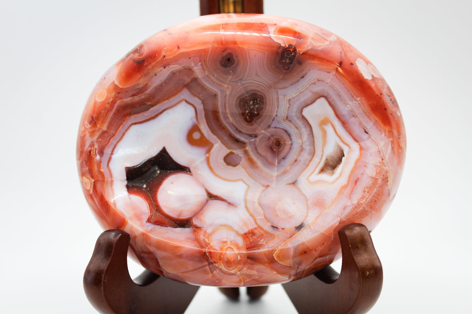 Polished carnelian crystal shaped into a bowl.